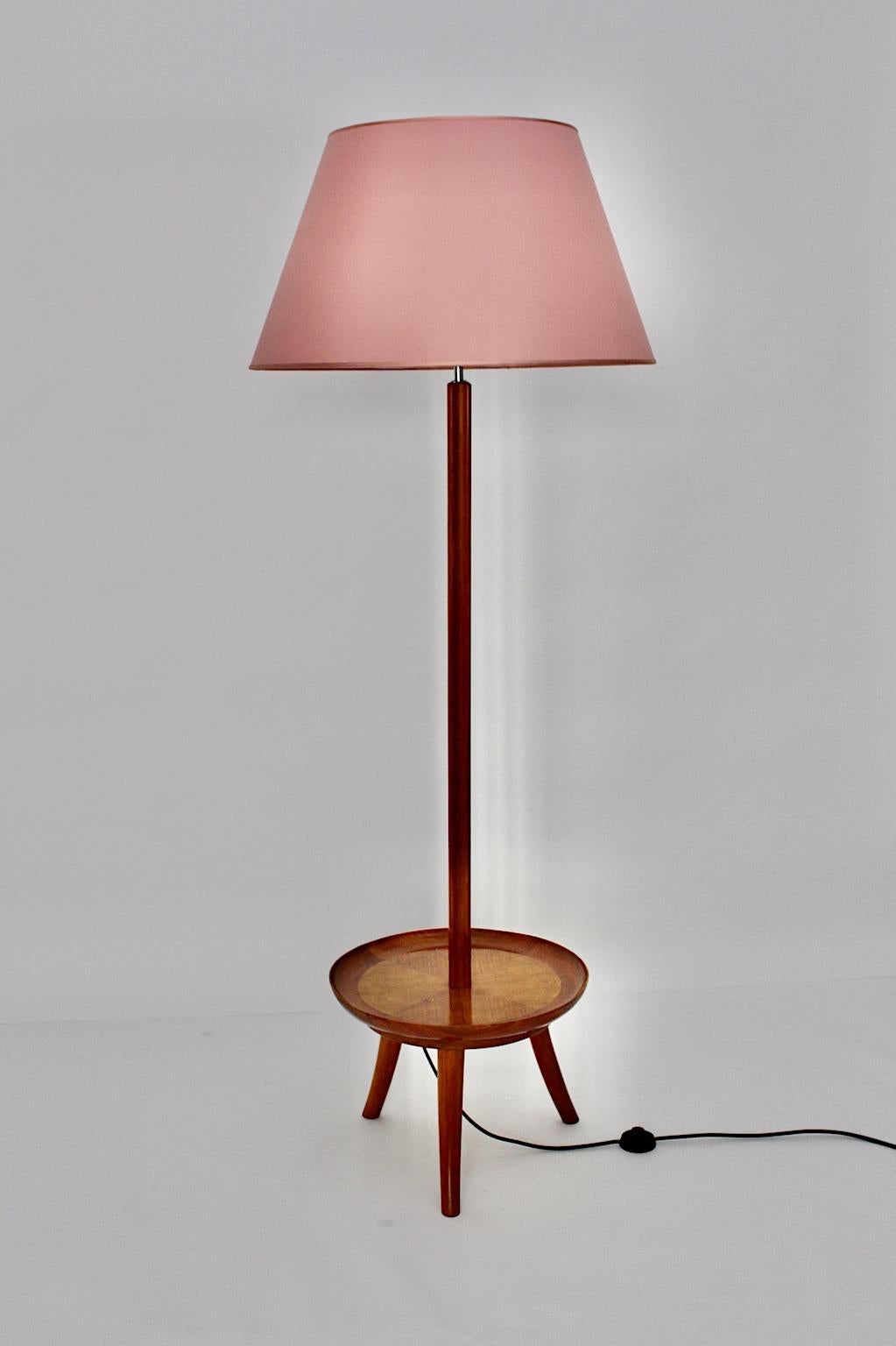 Art Deco floor lamp from solid cherrywood and veneered cherrywood designed in the style of Josef Frank and manufactured 1930s, Vienna.
A wonderful floor lamp with a composition of a circular like table with a stellar veneered plate also with a