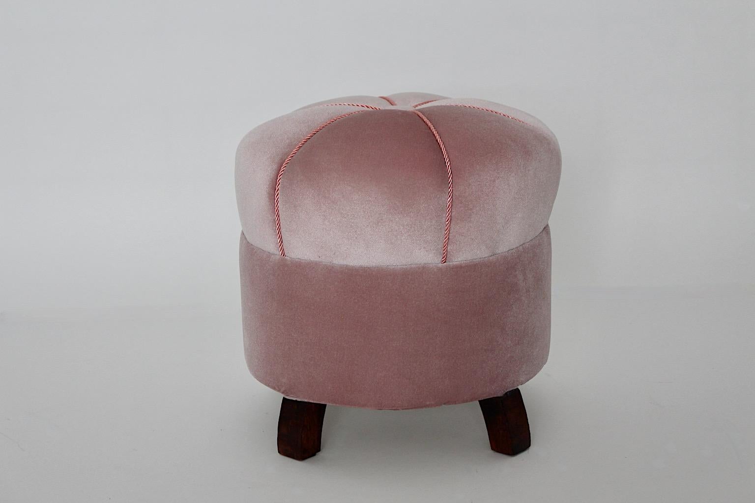Art Deco vintage circular pouf, stool or ottoman new upholstered and covered with soft pink velvet fabric 1930s Austria.
A stunning and elegant stool or pouf new upholstered and covered with feminine elegant soft pink velvet fabric. One decor button