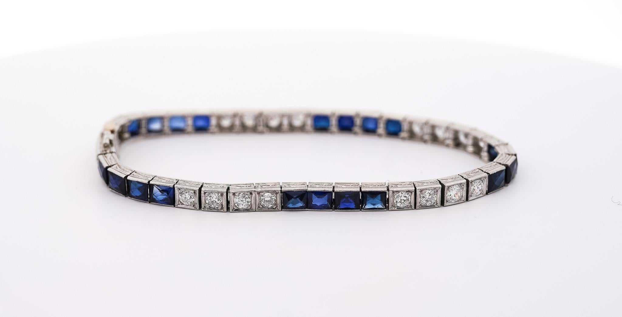 Vintage Platinum Filigree Bracelet with Diamonds and Synthetic Blue Sapphires. Circa 1935. 

Elevate your collection with this exquisite Vintage Art Deco Platinum Filigree Square Link Bracelet. Crafted with meticulous detail, this bracelet features