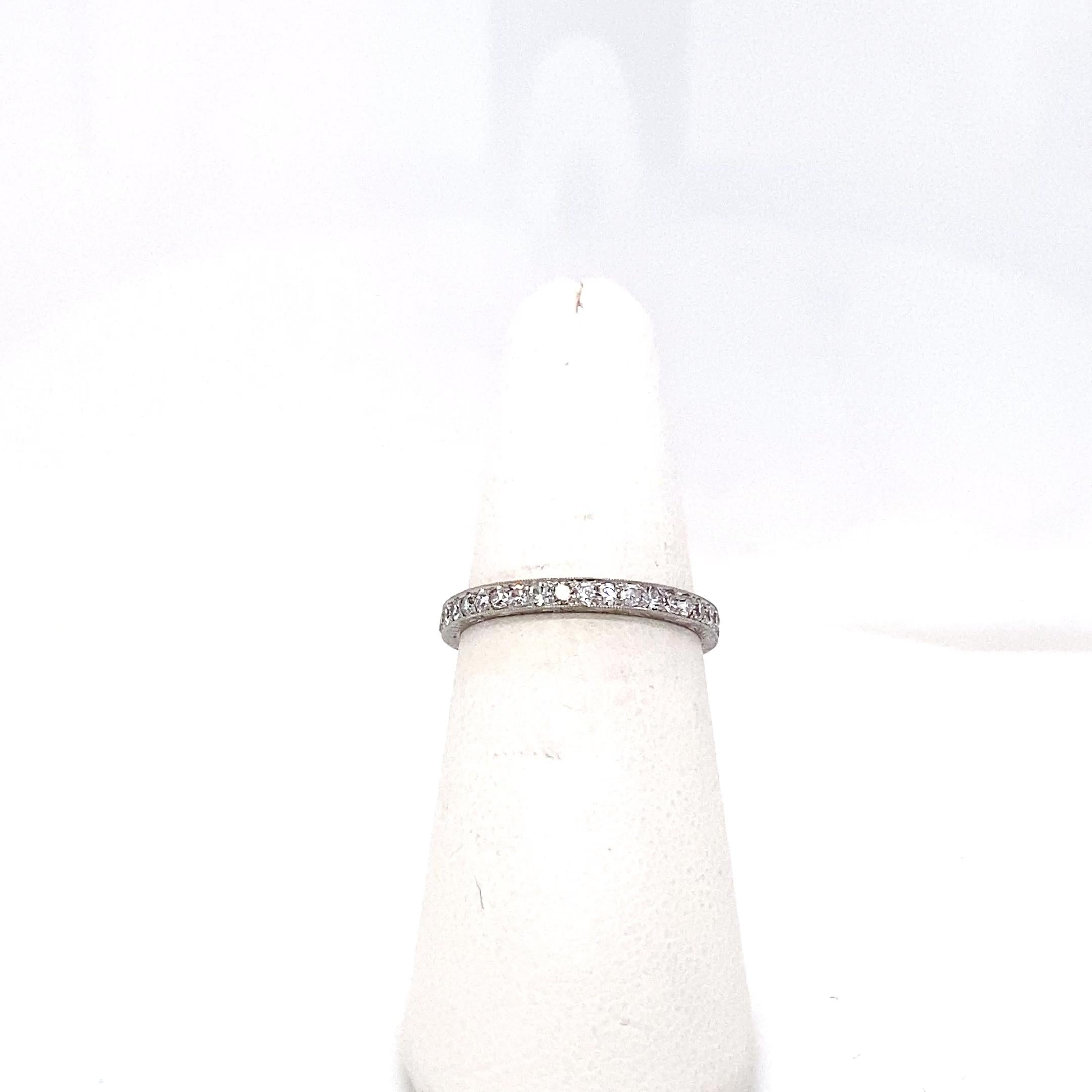 This Art Deco diamond eternity band is a quiet masterpiece of craftmanship. Forged in platinum, the 2.5mm wide band is adorned with 39 old single-cut diamonds weighing approximately 0.55 carat total, each carefully bead set within a milgrain-edged