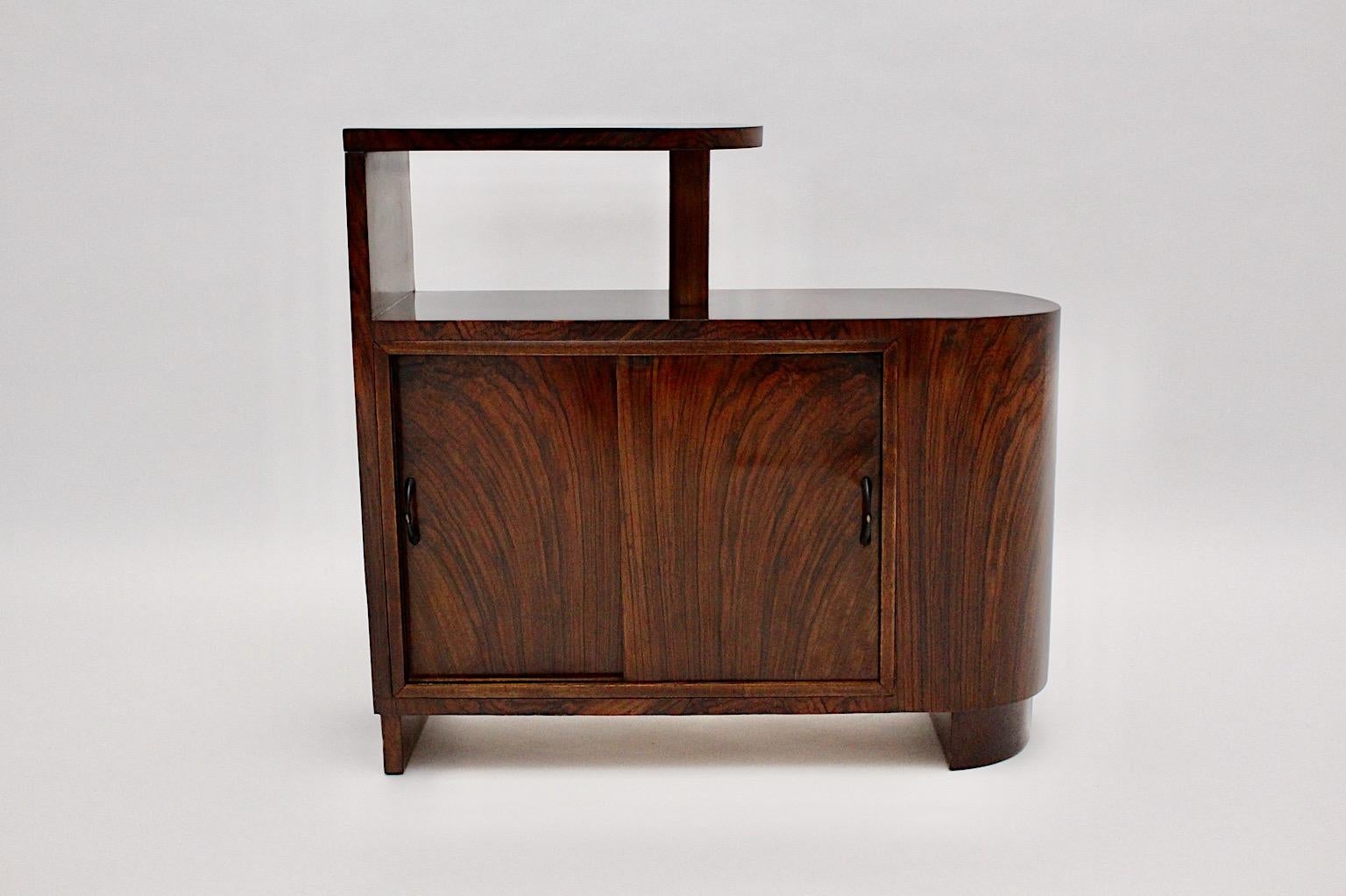 Art Deco vintage room divider or small chest from walnut circa 1930, Vienna.
A wonderful Art Deco vintage freestanding room divider or small chest from lively walnut veneer and spruce in smoothly chocolate brown color tone.
The surface is shellac