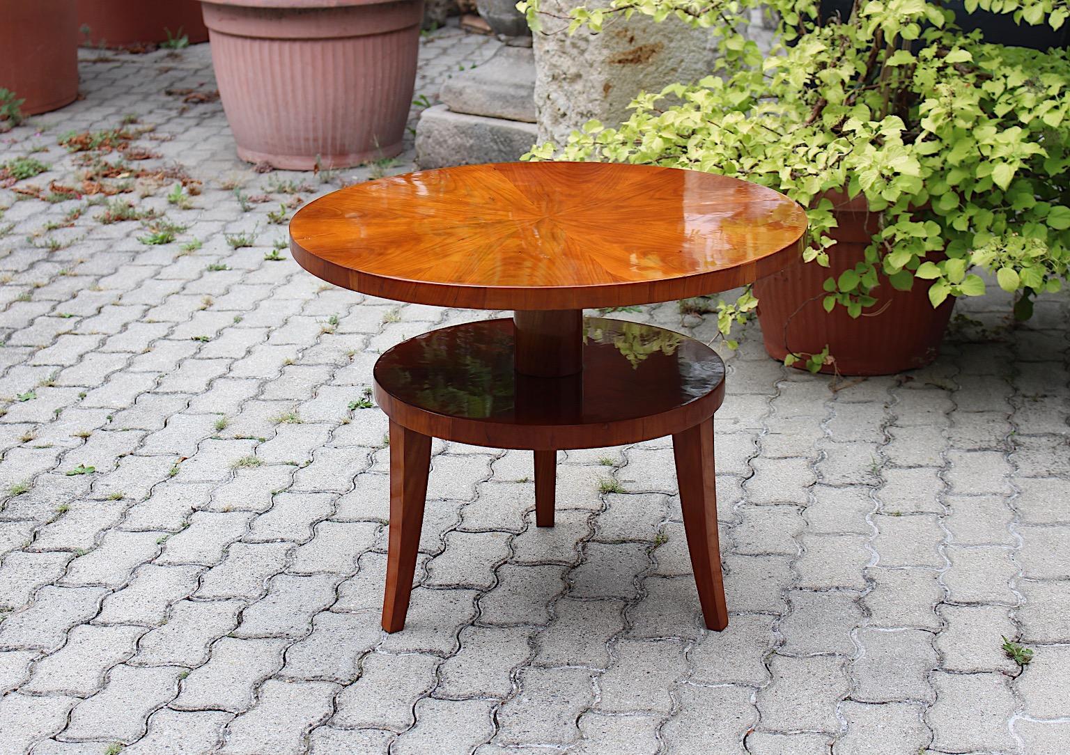 Art Deco Vintage circular like cherry side table or coffee table attributed to Ludwig Schmitt circa 1925 Austria.
A stunning three legged and two tiered side table of coffee table from
cherry wood attributed to the manufacturer Ludwig Schmitt circa