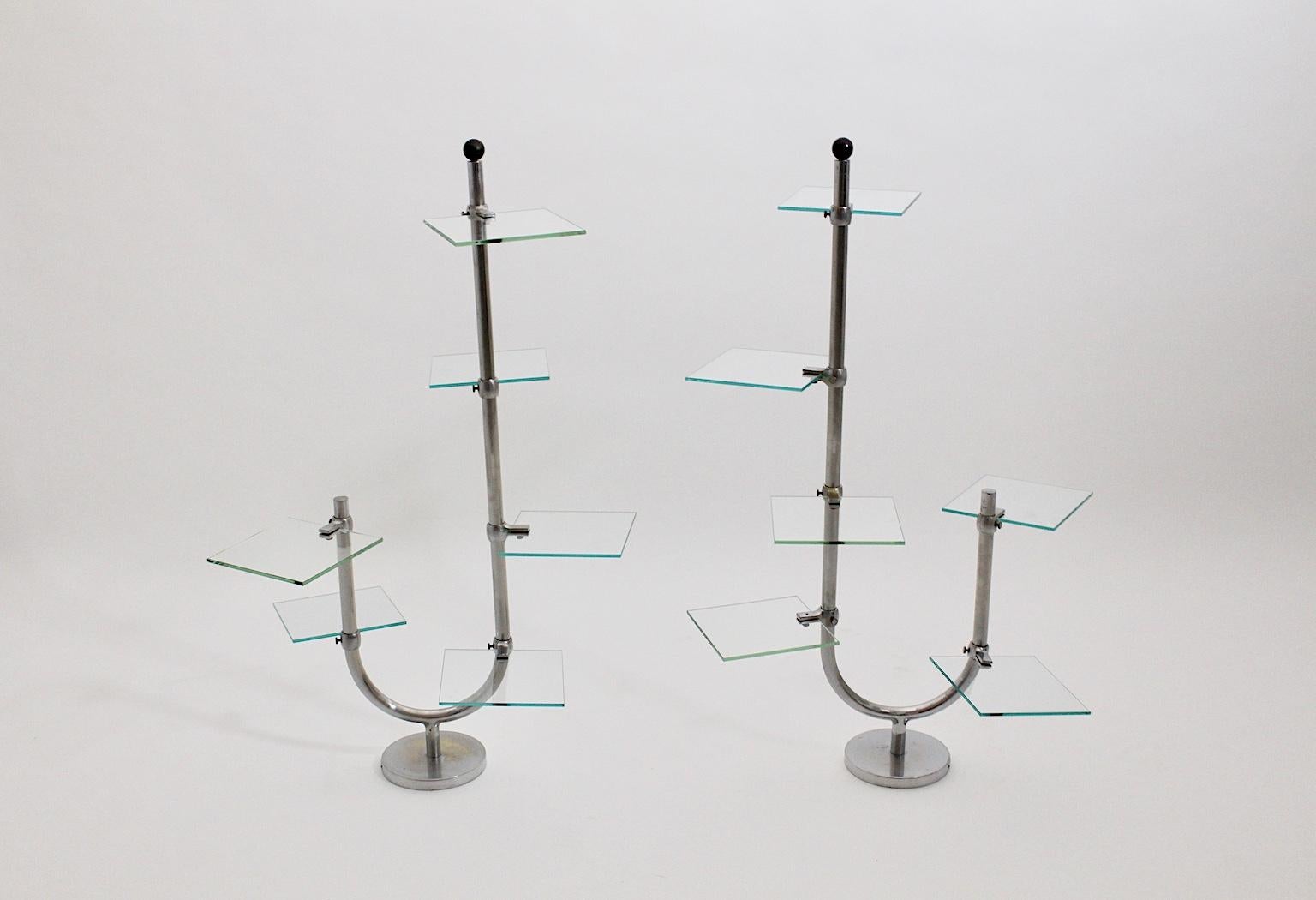 This outstanding pair of vintage Art Deco / Bauhaus era flower stands or shelves were made of curved nickel-plated brass tubes. Furthermore each flower stand shows six adjustable mounts and six glass plates.
Labeled with a metal label: Etalages A.