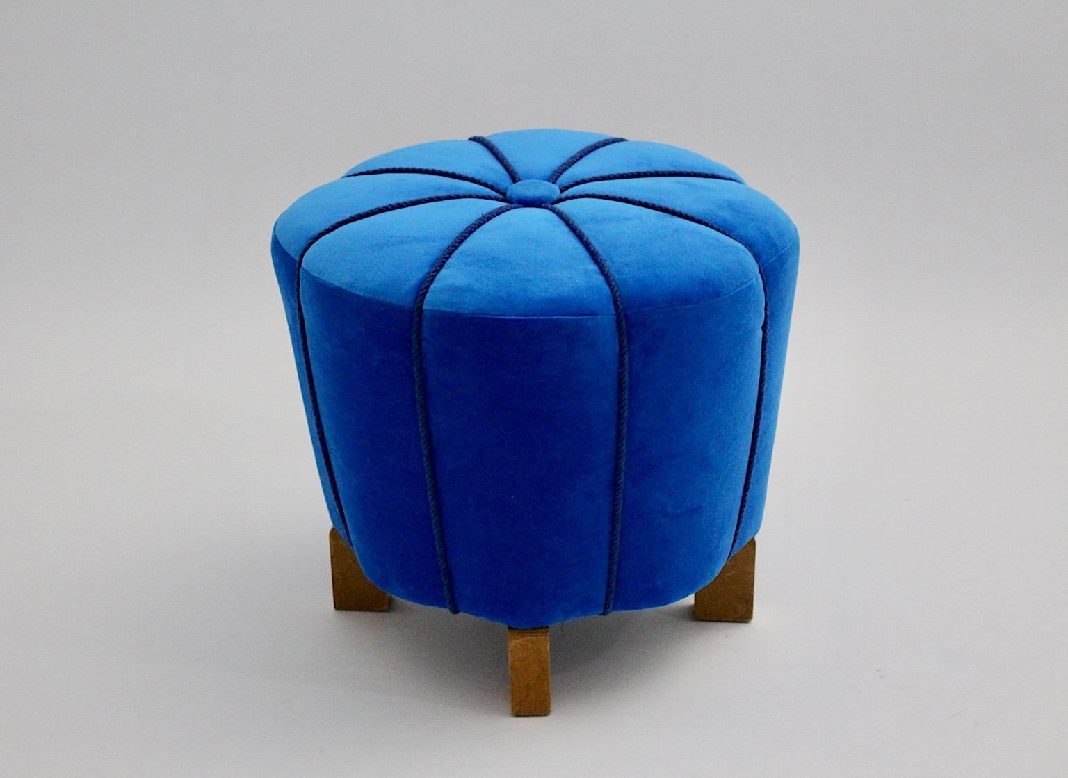 Art Deco vintage pouf or stool stellar - like from beech and velvet cover with blue cords 1930s Vienna.
An amazing vintage pouf or stool or footstool in beautiful stellar shape new covered with vivid blue velvet and blue cords.
This freestanding