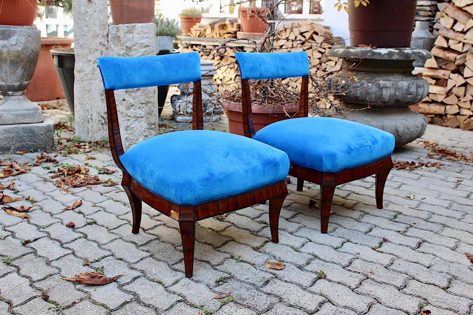 Art Deco Vintage Rosewood Blue Velvet Duo Pair of Side Chairs or Long Chairs in the circle of Wiener Werkstätte Hugo Gorge Dagobert Peche Vienna circa 1925.
A beautiful pair of side chairs or long chairs from rosewood and a new cover from electric