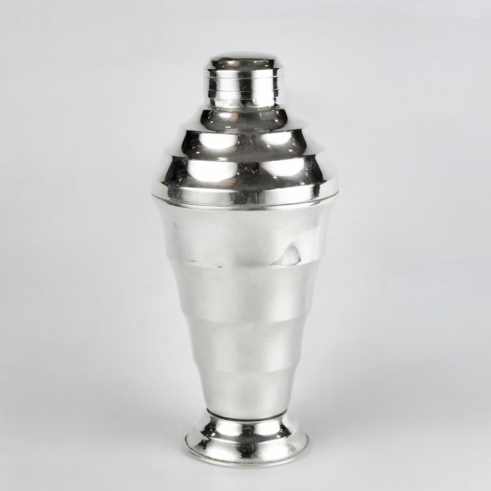 A Nice French Silver Plated Art Deco Cocktail Shaker in Stepped design comes apart in the centre with pull off lid
 - circa 1930