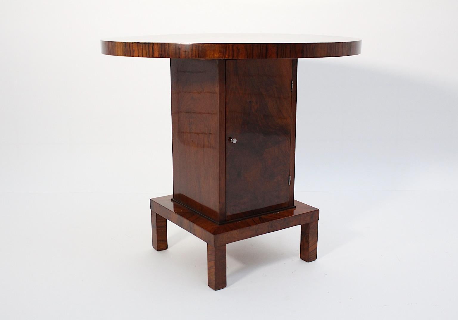 Art Deco vintage geometric sculptural side table side table from walnut in the style of Ludwig Schmitt circa 1930 Austria.
An amazing side table, very similar to Ludwig Schmitt furniture maker, with a circular plate and a rectangular integrated