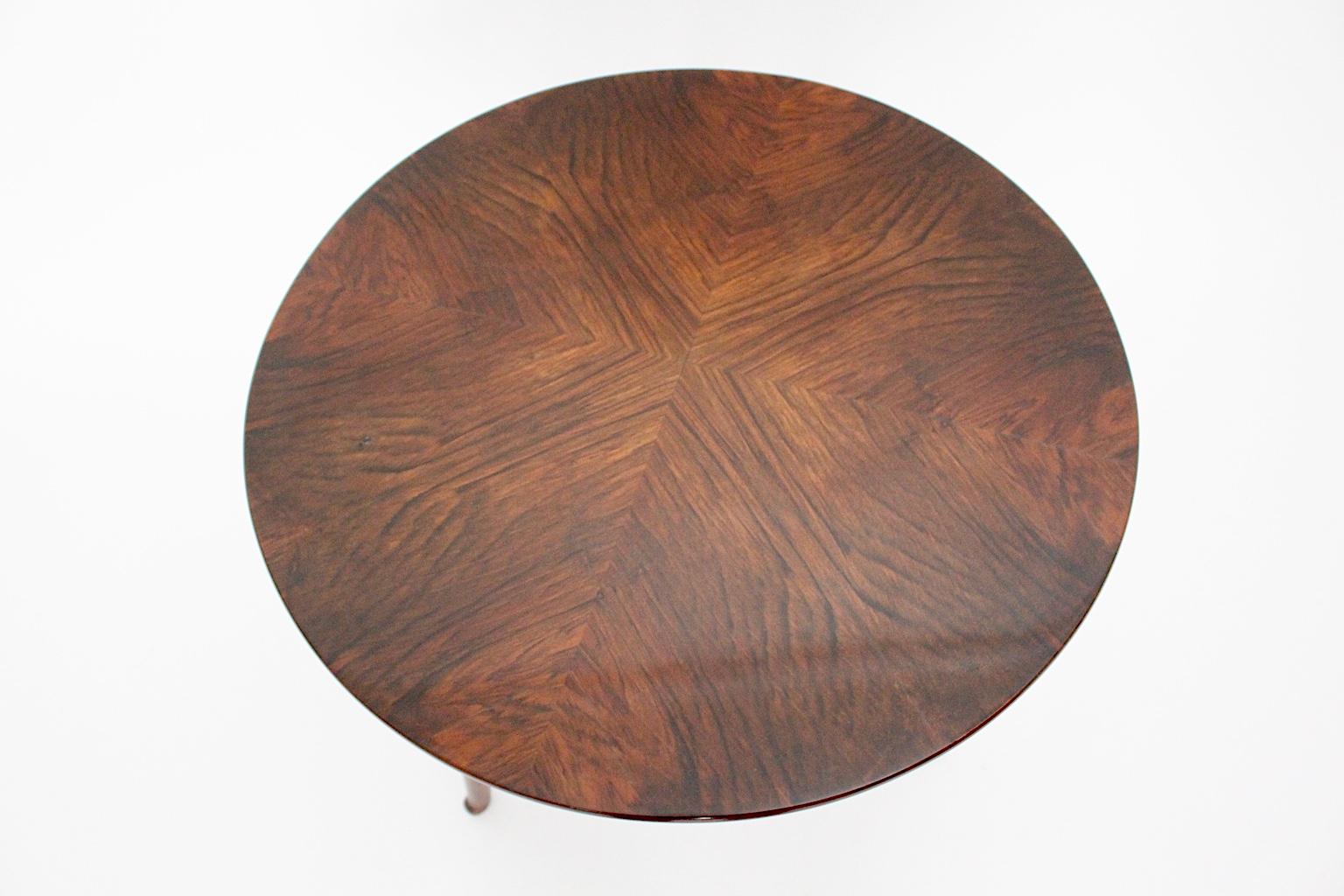 Art Deco vintage walnut side table / coffee table by Josef Frank for Haus & Garten, circa 1925 Vienna, shows a top with beautiful walnut burl veneer. This  trilegged side table from spruce and beech.
The simple and chic walnut side table was