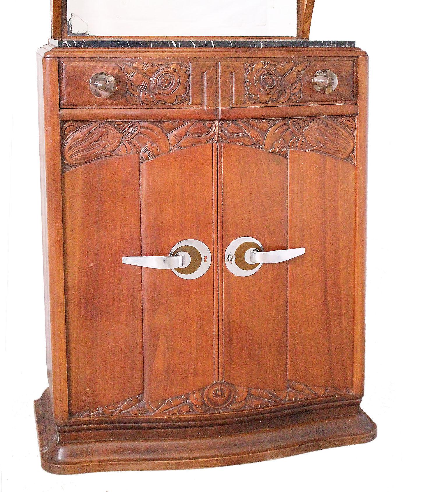 Art Deco vitrine credenza sideboard cabinet, circa 1930 
All original
Very unusual
Carved floral motifs
Mirror back and variegated black marble
Glass cabinet
A small mistake in the title : this Cabinet is of walnut
Please see Art Deco Credenza