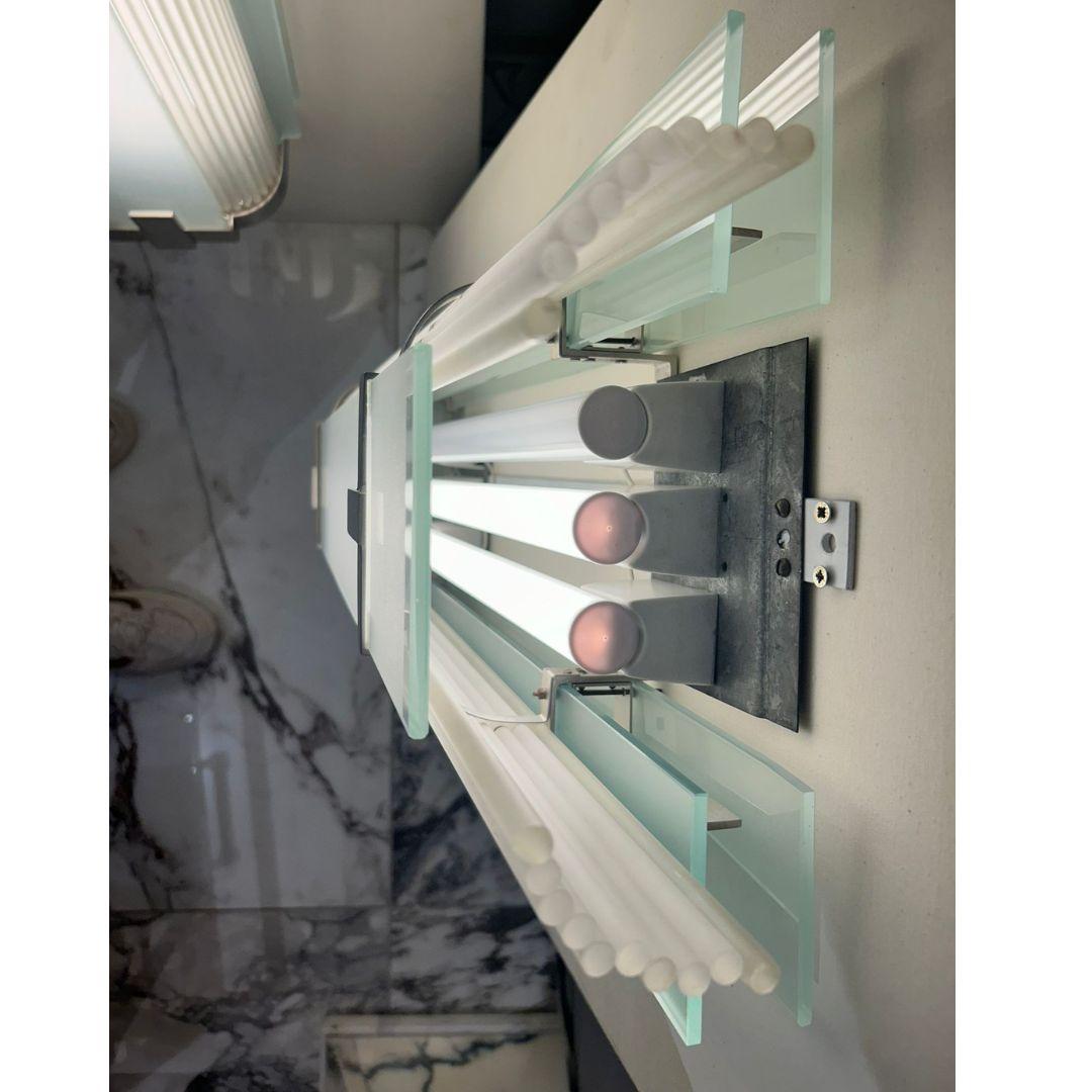 This impressive PETITOT wall lamp, designed in Paris circa 1930, is a rare find, especially in such remarkable condition. Renowned for their intricate designs and luxurious materials, PETITOT lamps are icons of French Art Deco, merging elegance with