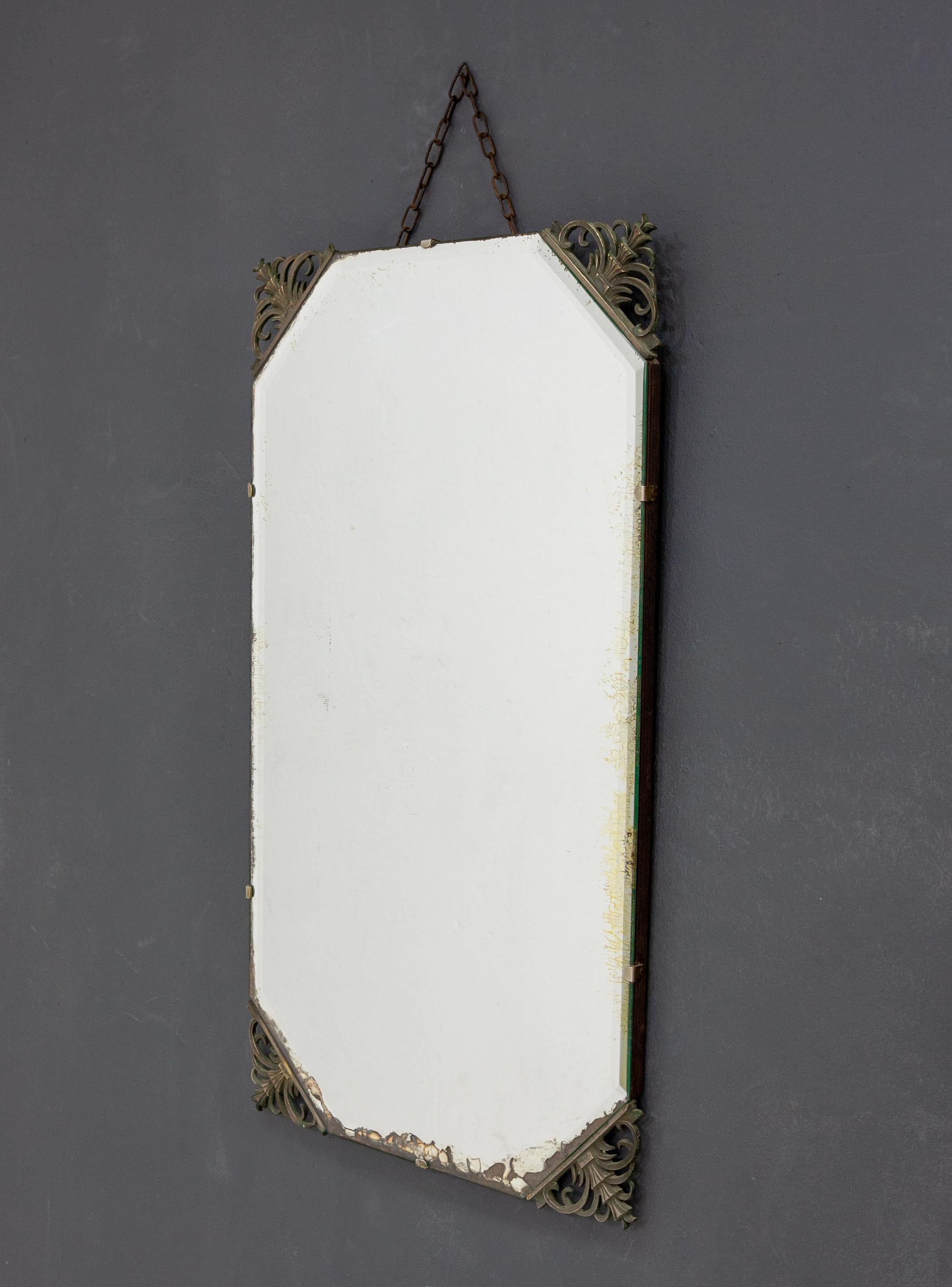 Real Art Deco wall mirror. Very stylish. Decorative nickel corners pieces. Typical Art Deco shaped.
The mirror itself is distressed on a real nice way. Structural good. Complete and all original.
1920-1930, France.


 