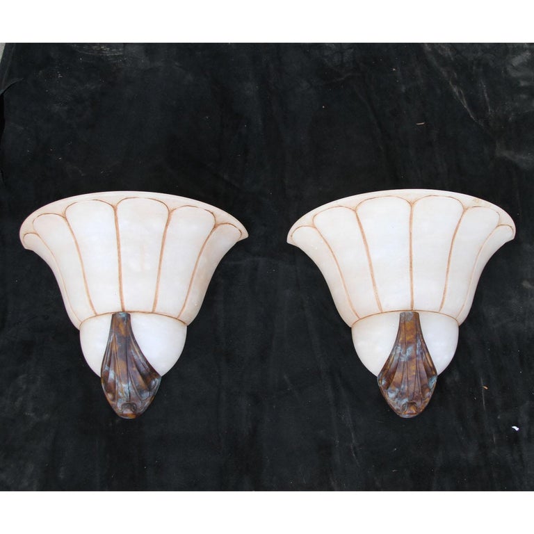 Art Deco Sconces

Pair of stunning alabaster sconces with brass ribs and bottom cap.  

Dimensions: 13 × 11 × 6.5 in
