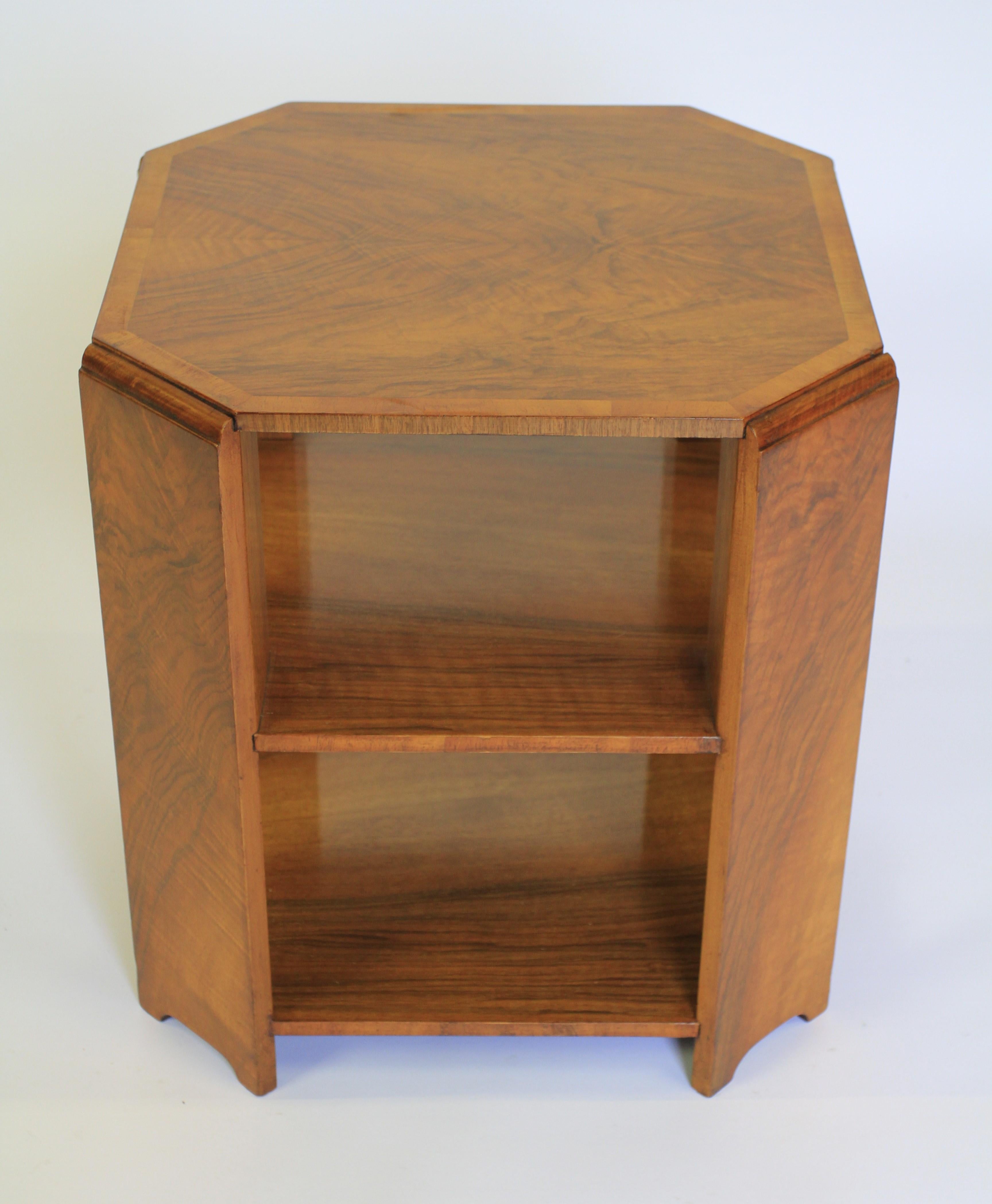 Art Deco Walnut 2 Tier Book Table circa 1930s
Top With book match veneer & cross banding

4 canted corner slab sides, with arch base

2 tier shelves to hold books
Recently Polished
Good Quality Table