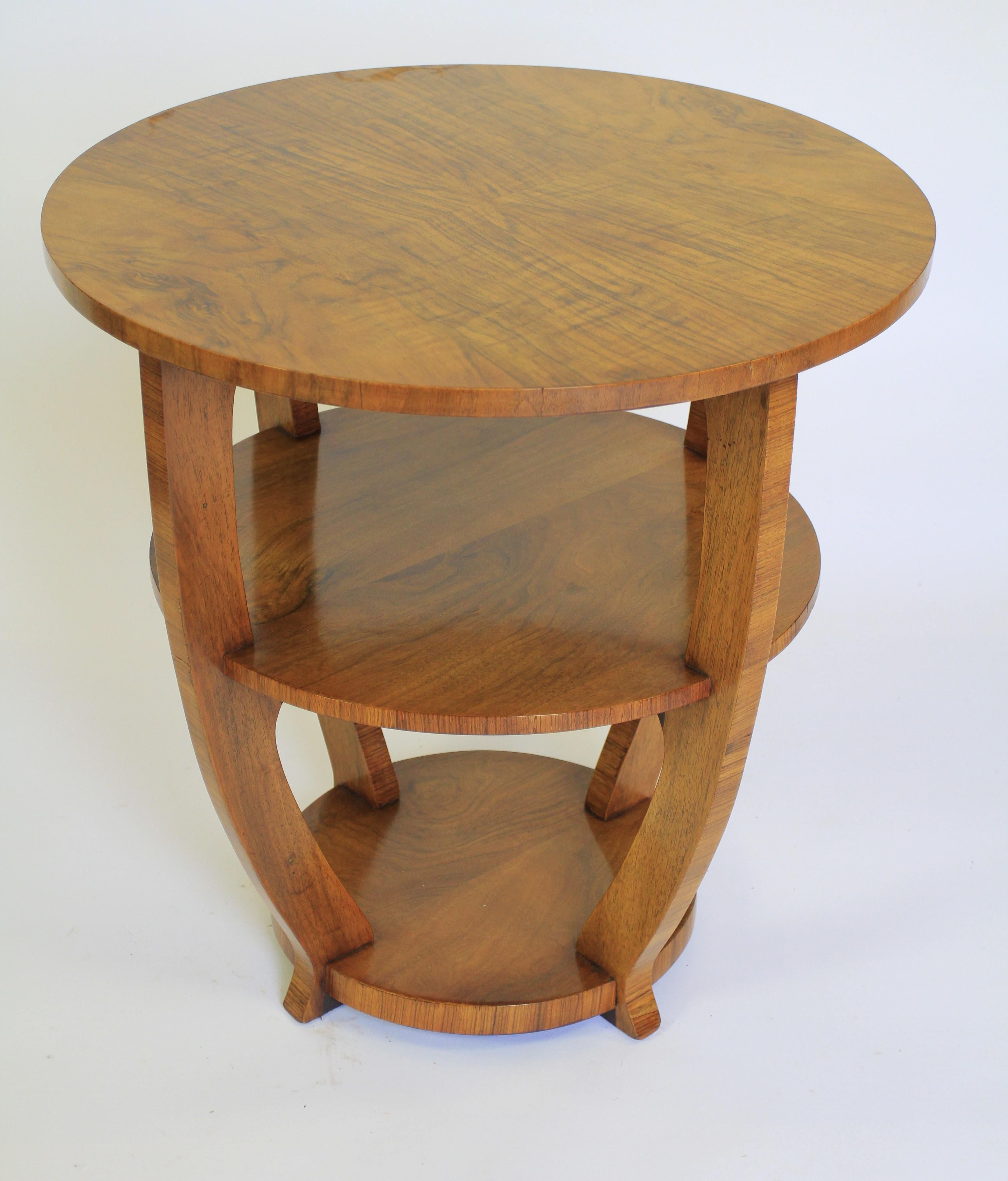 Art Deco Walnut 3 Tier Lamp Table circa 1930s
Figured Walnut Tops 
4 curved Supports, 
Squat splayed feet
Recently Polished
Good Art Deco in Shape