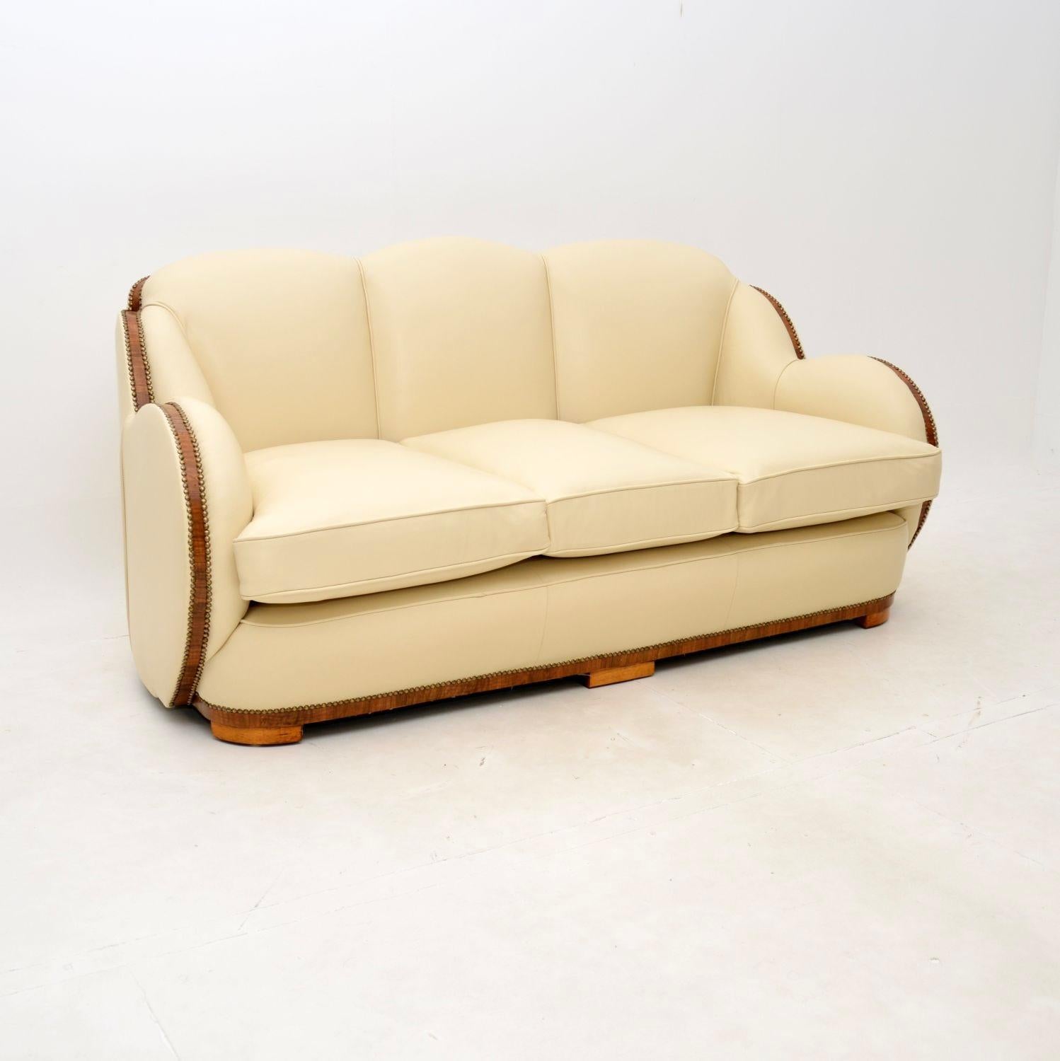 A fantastic Art Deco walnut and leather cloud back armchairs and sofa by Epstein. This was made in England, it dates from the 1920-30’s.

It is of superb quality with a gorgeous design, it is also very comfortable. The sides and back rests have a