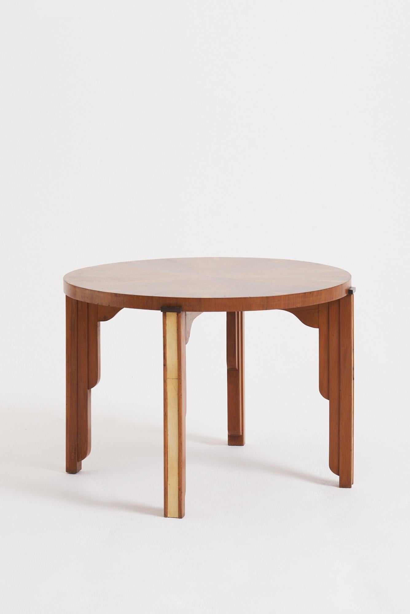 An Art Deco walnut and velum side table.
France, Circa 1930
56 cm high by 80 cm diameter