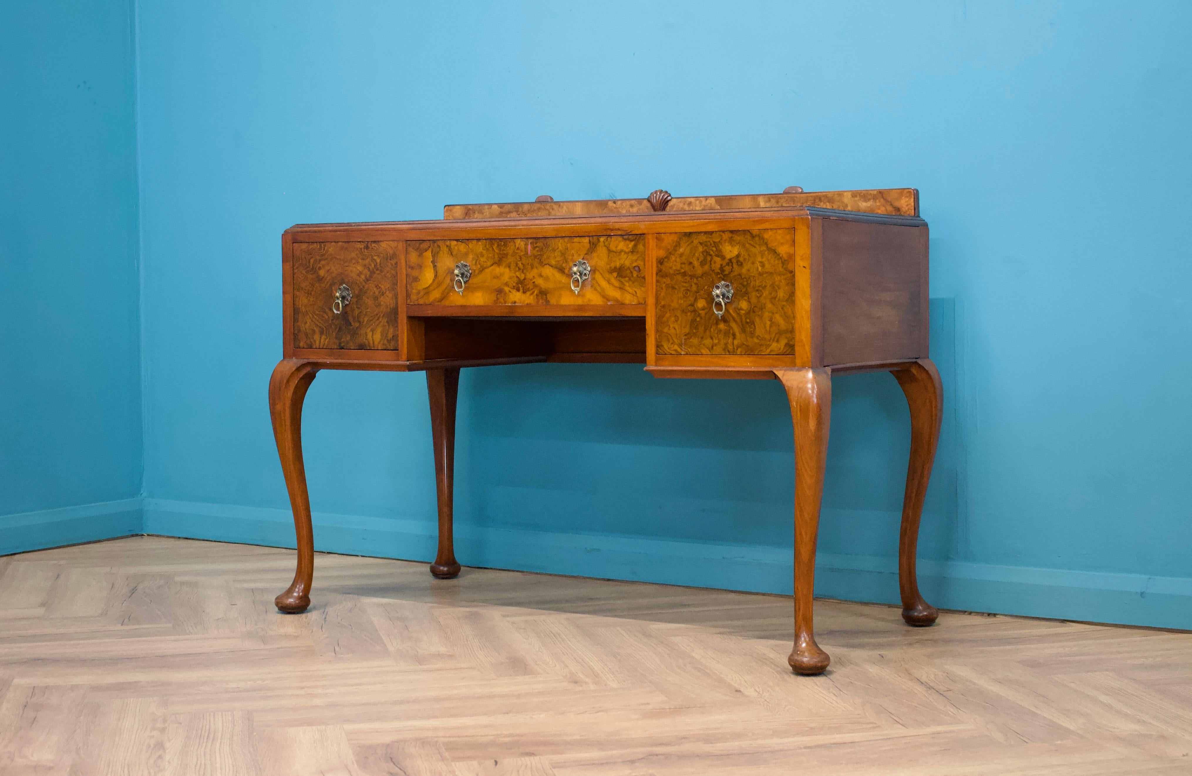 An impressive quality Art Deco burr walnut dressing table, circa 1930s


The original mirror has been removed -  a freestanding dressing table mirror could be used in place or a wall mounted mirror
Alternatively this has good proportions to use as a