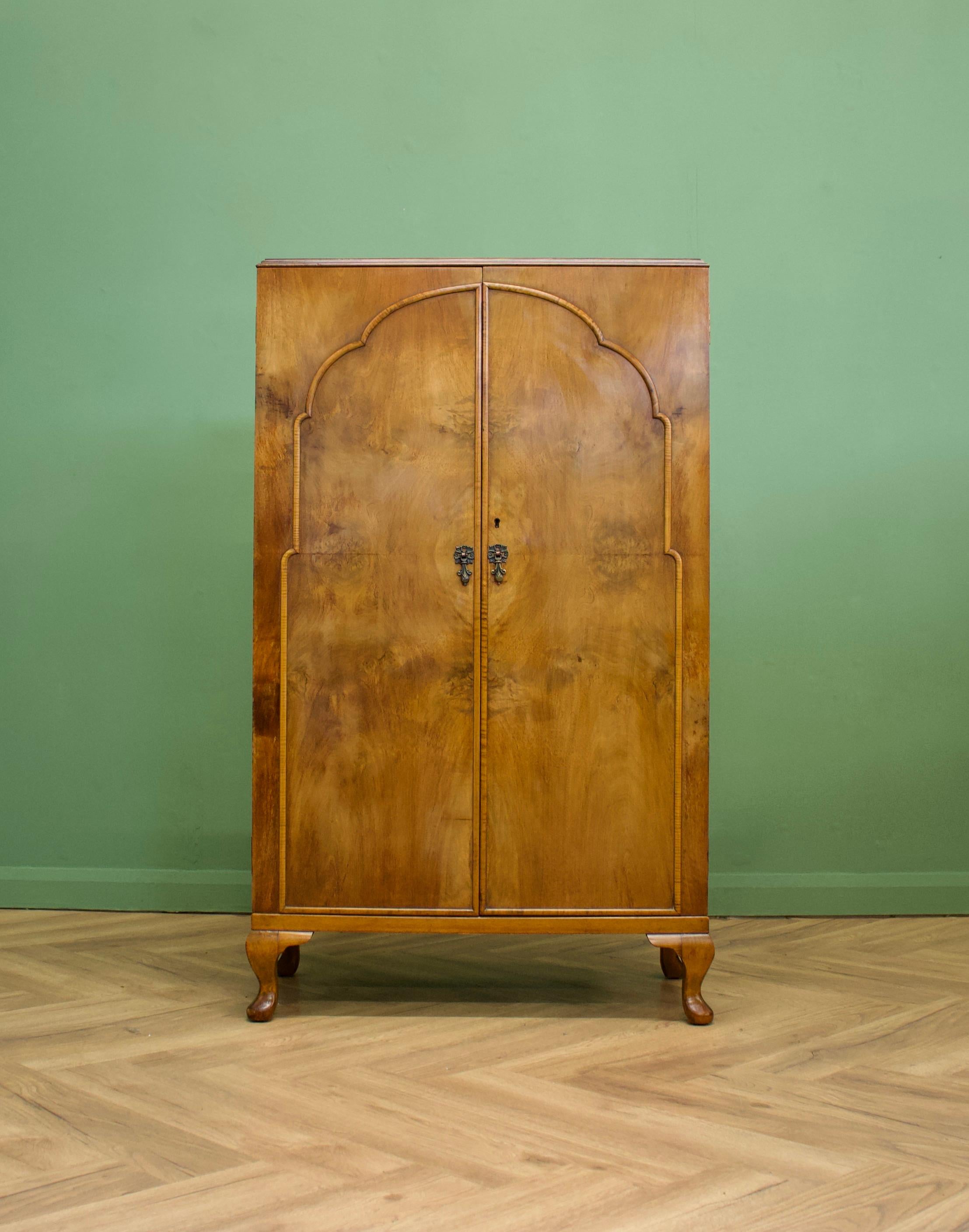 - Art Deco tallboy or linen cabinet
- Made from walnut and walnut veneer
- Made in the UK by Waring and Gillow during the 1930s.