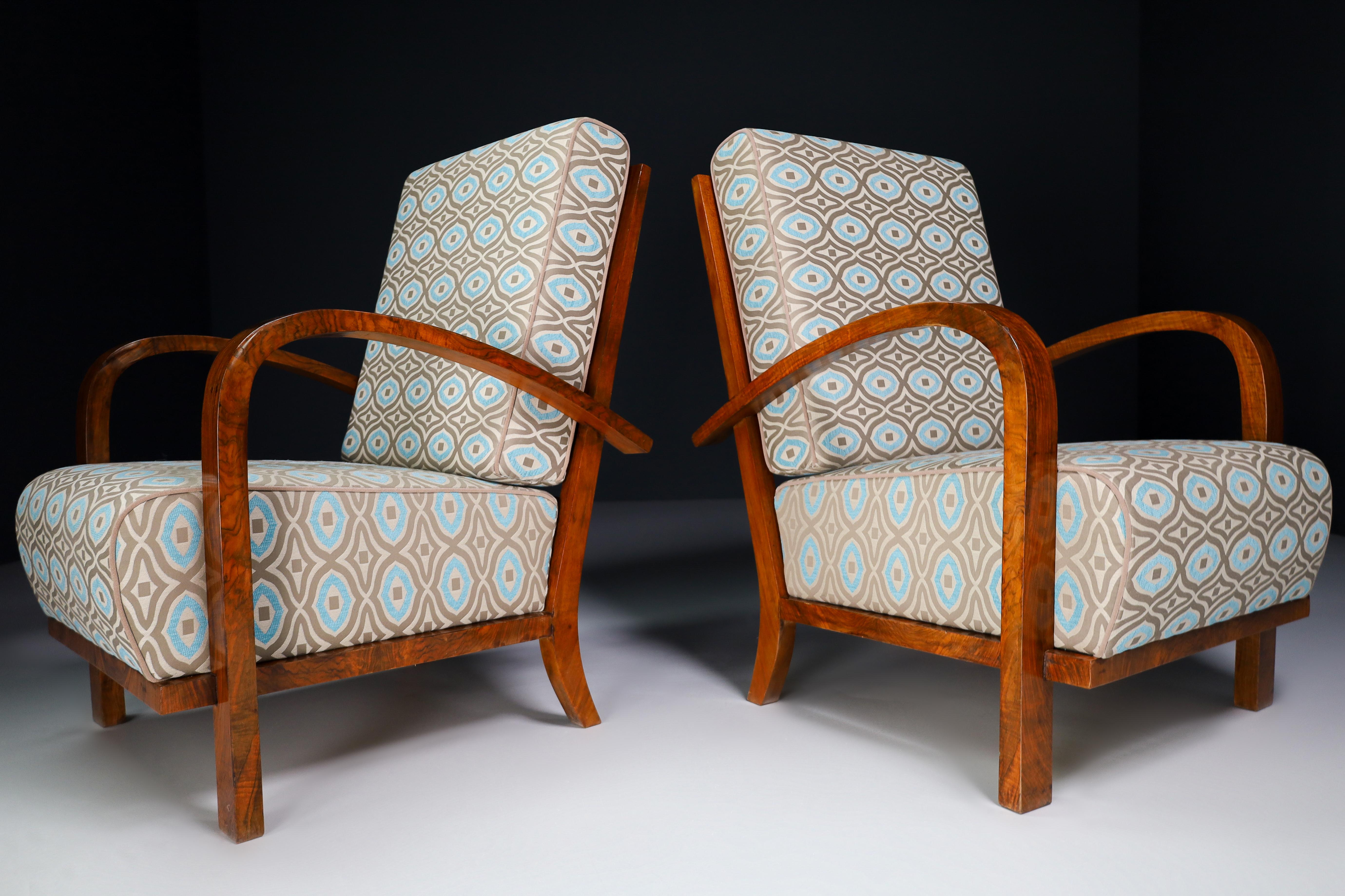 Pair of two Art-Deco lounge / arm chairs, walnut bentwood and re-upholstered fabric, Praque 1930s. These armchairs would make an eye-catching addition to any interior such as living room, family room, screening room or even in the office. It also