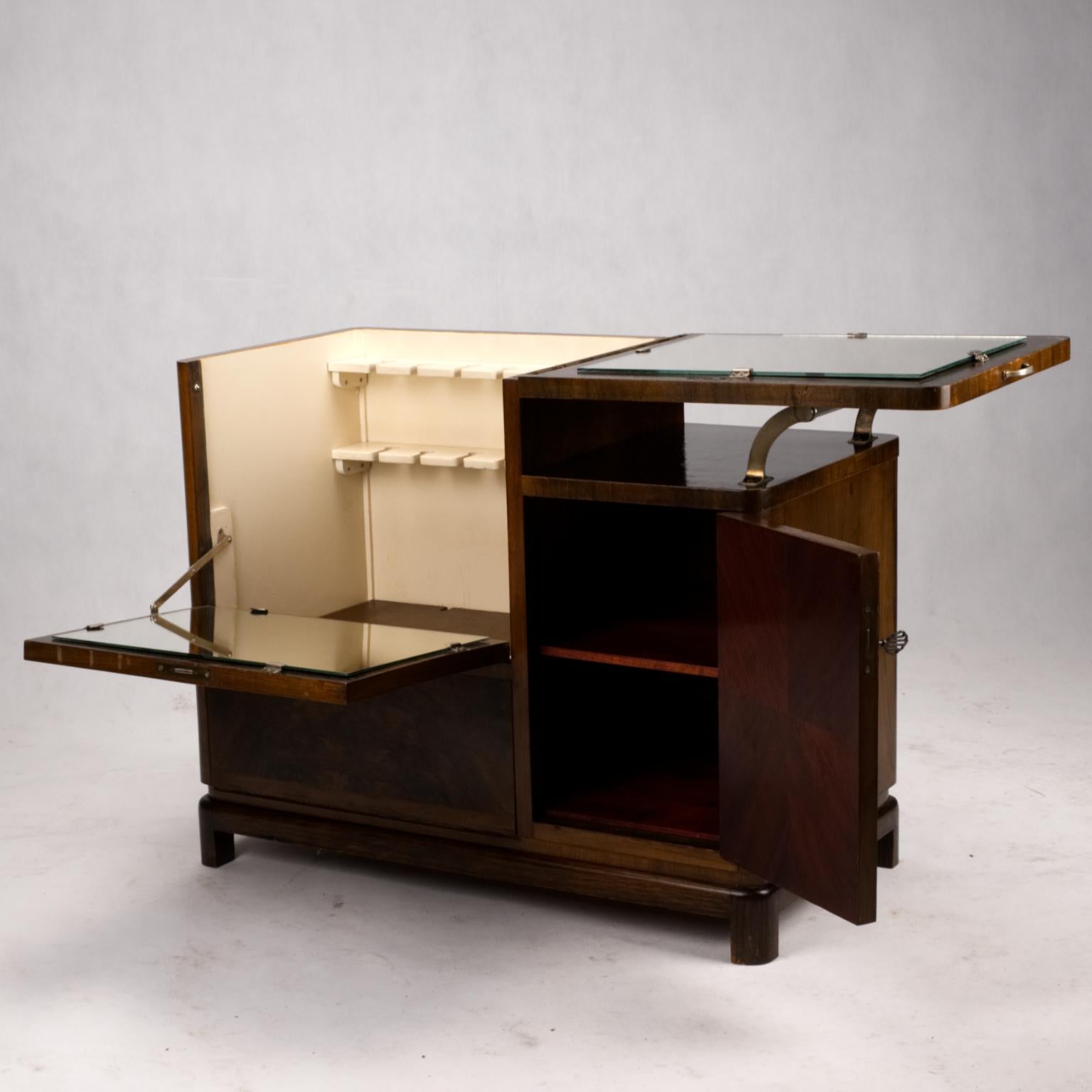 Art Deco bar cabinet in walnut weneer in original condition. Manufactured in Czechoslovakia in 1930s.