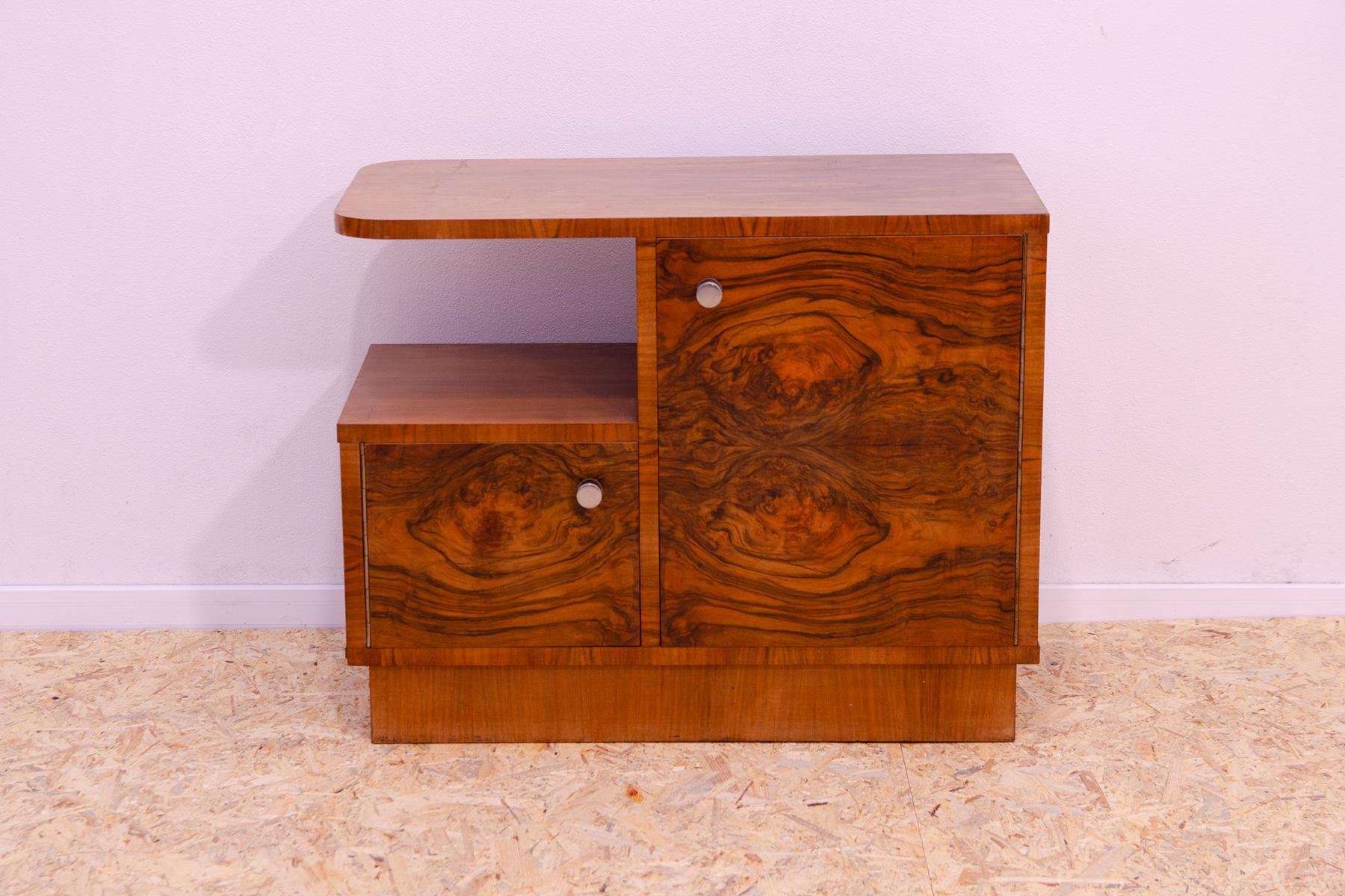 This midcentury ART DECO bar or sideboard was made in the 1930´s in the former Czechoslovakia.

It´s charakterized a very simple and practical design.
It´s a beautiful example of Central European ART DECO furniture design. It´s in good preserved