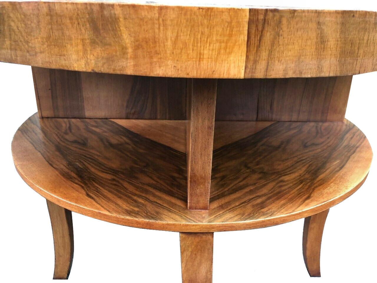 Stylish Art Deco book table in attractively patterned figured walnut veneer with a warm mid tone coloring will ensure this piece integrates easily in most settings. The quarter veneer top is particularly attractive and the under tier quadrant