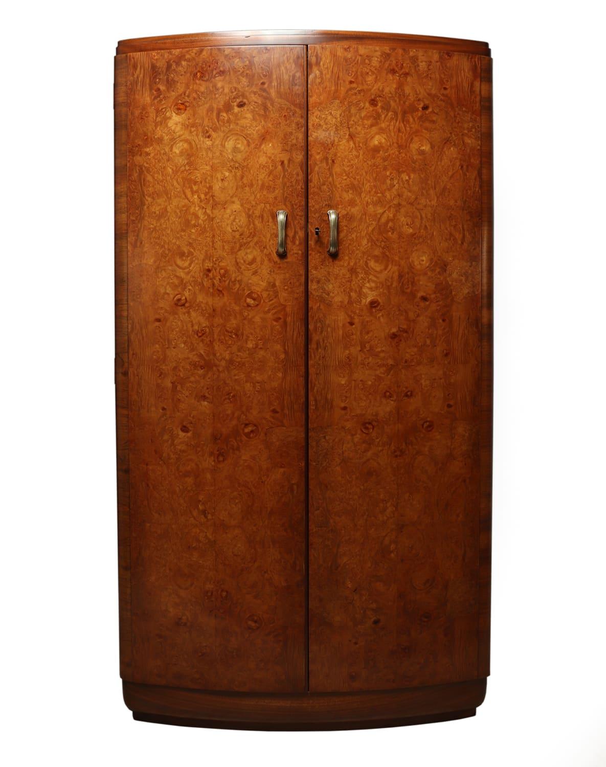 Art Deco walnut bow front gentleman wardrobe circa 1930
A fine quality English bow fronted burr walnut fitted gentleman's wardrobe having brass handles, the fitted interior has two drawers and a slide out trouser rail, the wardrobe has been fully