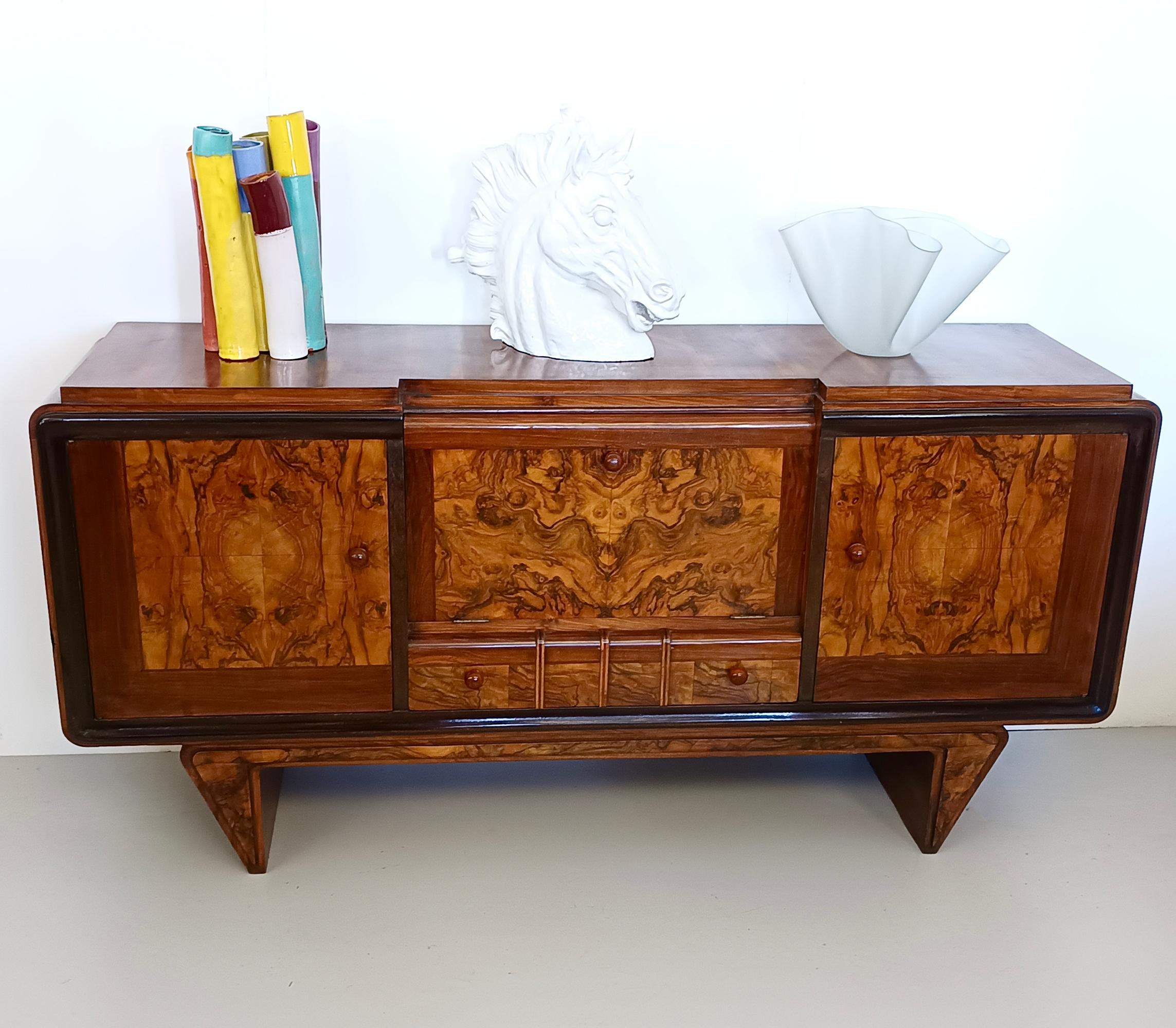Made in Italy, 1940s. 
This stunning and elegant sideboard is made in walnut, briar root and ebonized beech and features bachelite handles. 
It is a vintage item, therefore it might show slight traces of use, but it can be considered as in excellent