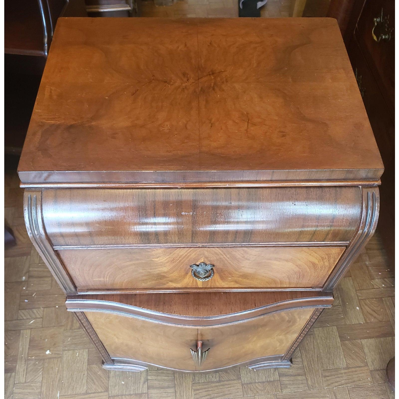 1930s Art Deco waterfall nightstand, end table or side table. It has a dark burl walnut front with two dovetail drawers that work as originally intended.
It measures 17 inches in width , 14 inches in depth and 27 inches tall.
It is in original