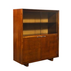 Art Deco Walnut Cabinet with Lucite Pulls & Glass Front by Gilbert Rohde