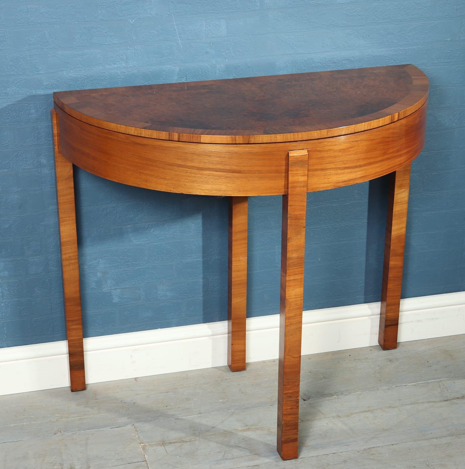 Art Deco walnut card table, circa 1930
A stunning quality, walnut demilune card table from the Art Deco period. This has a flip over, burr walnut, cross-banded top with pullout drawer / leg at the back to store cards and games. This table makes the