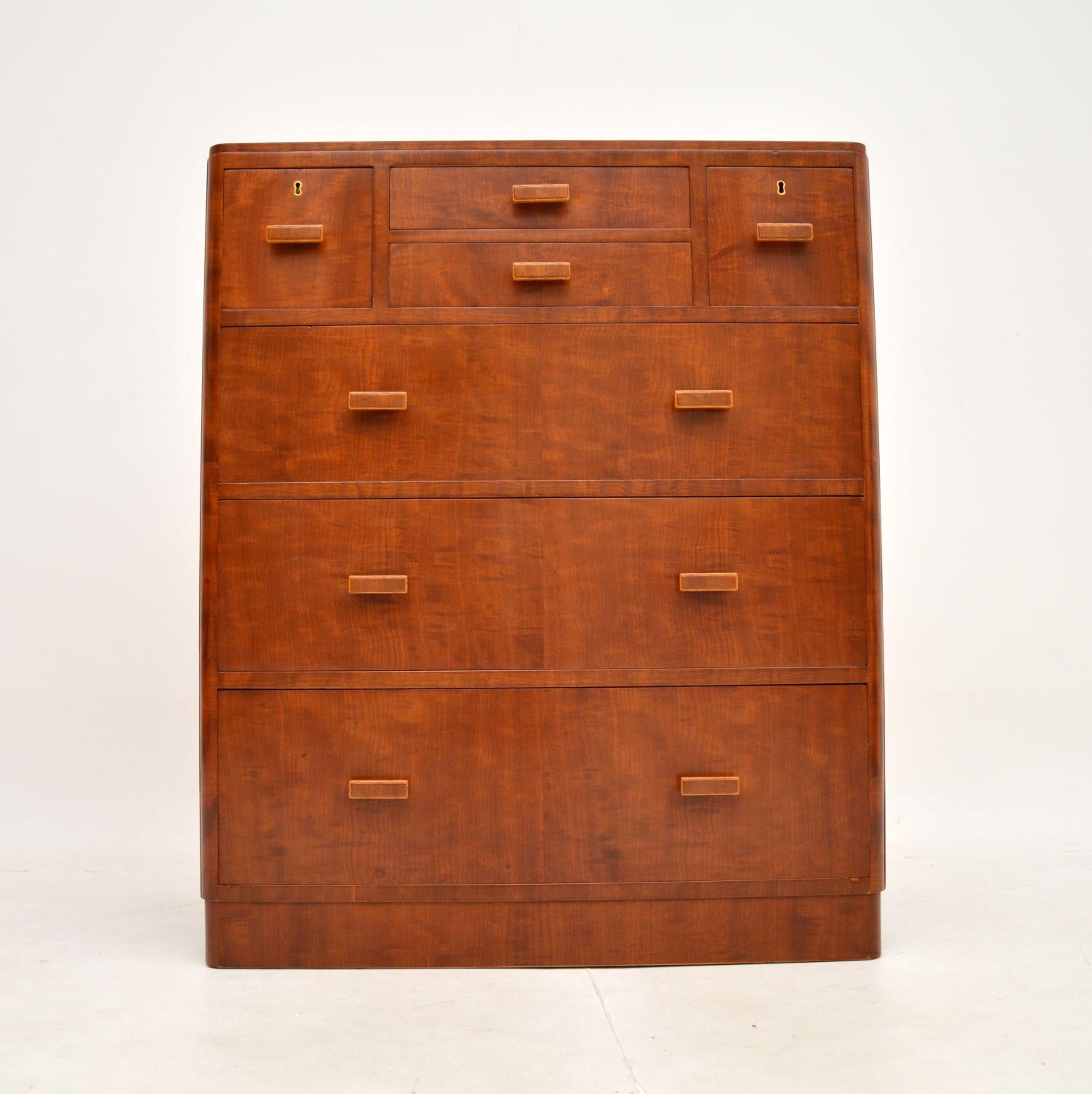 A fantastic Art Deco walnut chest of drawers by Heal’s. This was made in England, it dates from the 1920-30’s.

The quality is outstanding, this is beautifully made with walnut veneers. There is lots of storage space inside, with an interesting