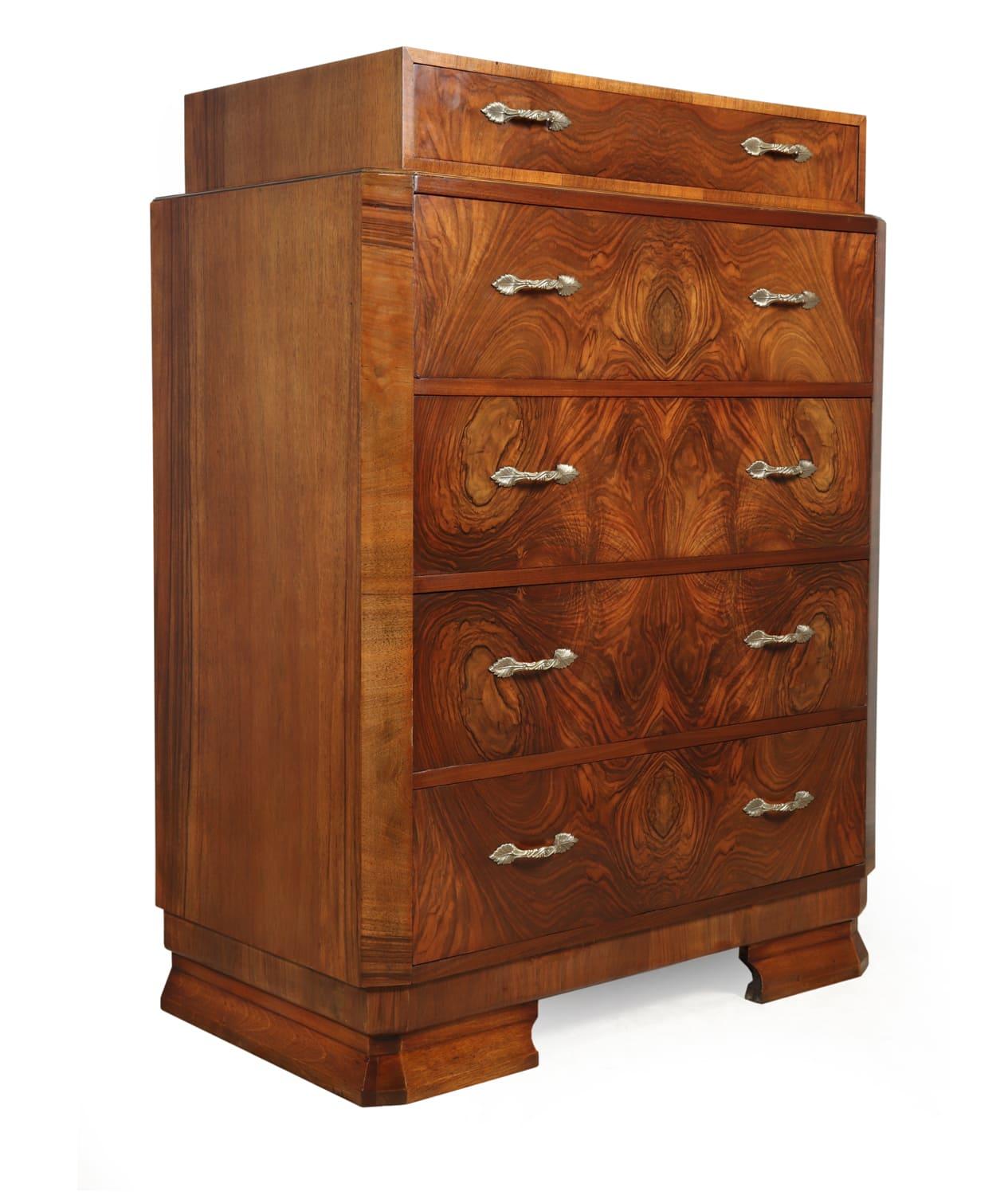 Art Deco walnut chest of drawers, circa 1930

A large walnut Art deco chest of drawers, having five drawers with dovetail joint construction canted corners and decorative brass handles, the chest is in excellent condition throughout and has been