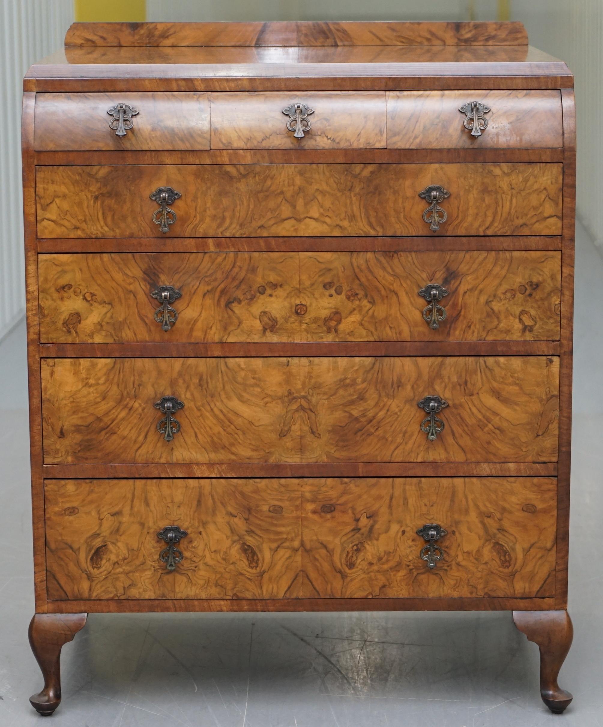 We are delighted to offer for sale this stunning original Art Deco quarter cut Walnut chest of drawers stamped Guaranteed hand made by British craftsman

These drawers are very decorative and sculptural, the timber patina is glorious, its quarter