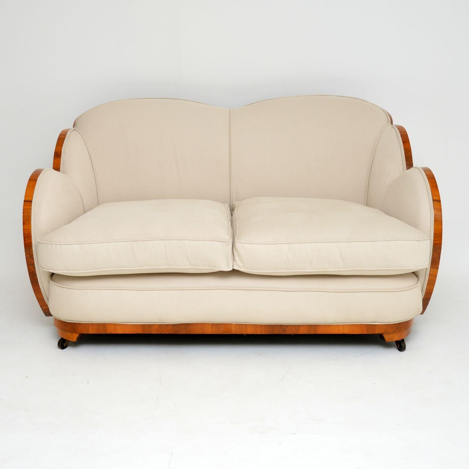 A stunning and rare original Art Deco cloud back sofa in walnut. This was made by H & L Epstein, and it dates from the 1930s period. We have had this fully restored, the walnut shell has been stripped and re-polished to a very high standard. This