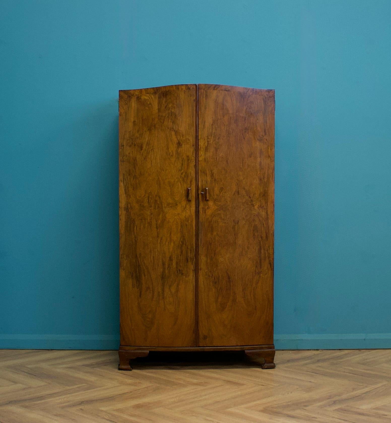 A quality Art Deco burr walnut compactum, circa 1930s

Featuring a hanging rail and shelves