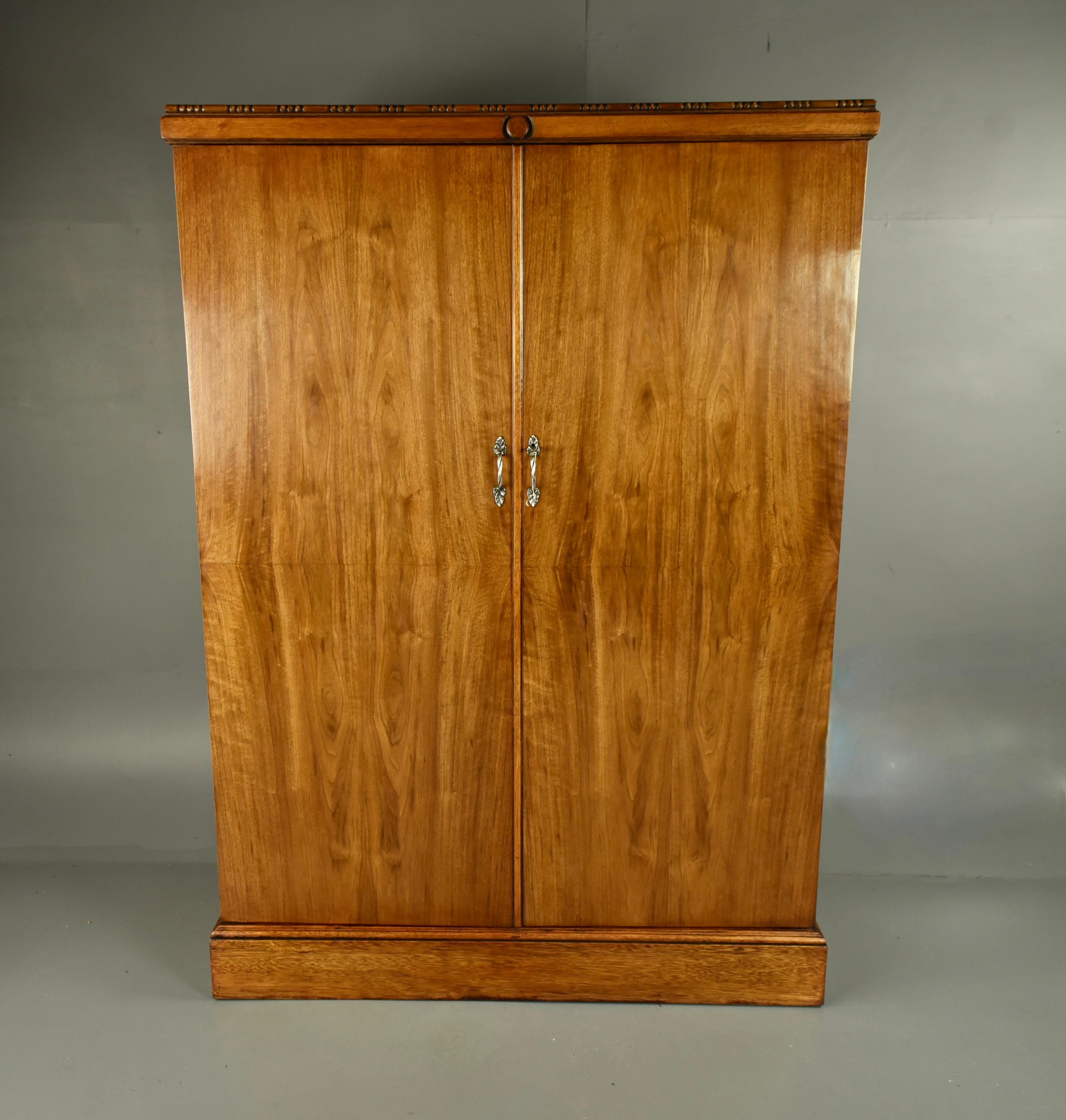 Original walnut compactom deep door gentleman’s fitted wardrobe model Y 
This iconic British made and designed wardrobe is in fantastic original condition 
The interior is fully fitted and retains all original labels and fittings 
The right hand
