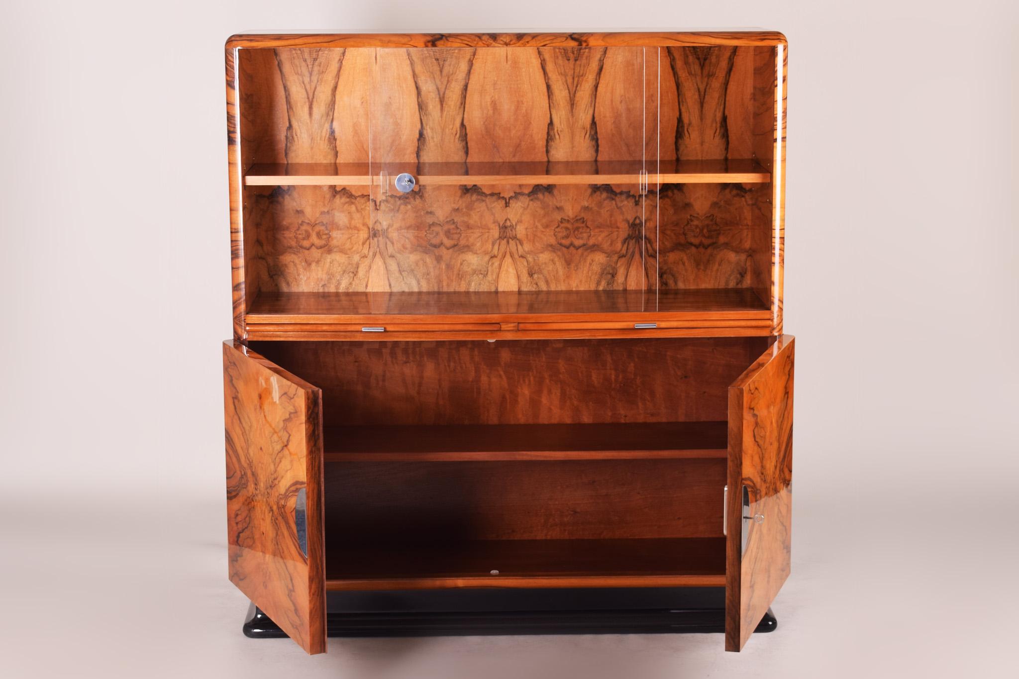 20th century Art Deco Display cabinet
Completely restored to high gloss
Material: Walnut.

We guarantee safe a the cheapest air transport from Europe to the whole world within 7 days.
The price is the same as for ship transport but delivery
