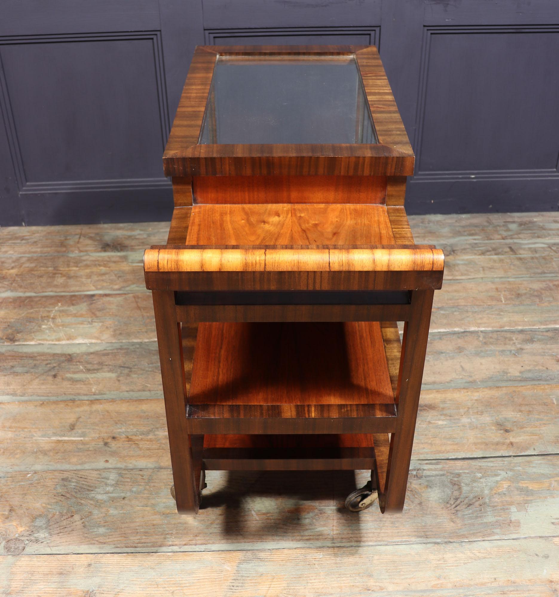 Art Deco drinks trolley
A rare to find Italian Art Deco drinks trolley in walnut wit glass cabinet produced in Italy in the 1940’s in walnut it has a tree their shelves with fully enclosed glass front section with sliding doors, it stands on four