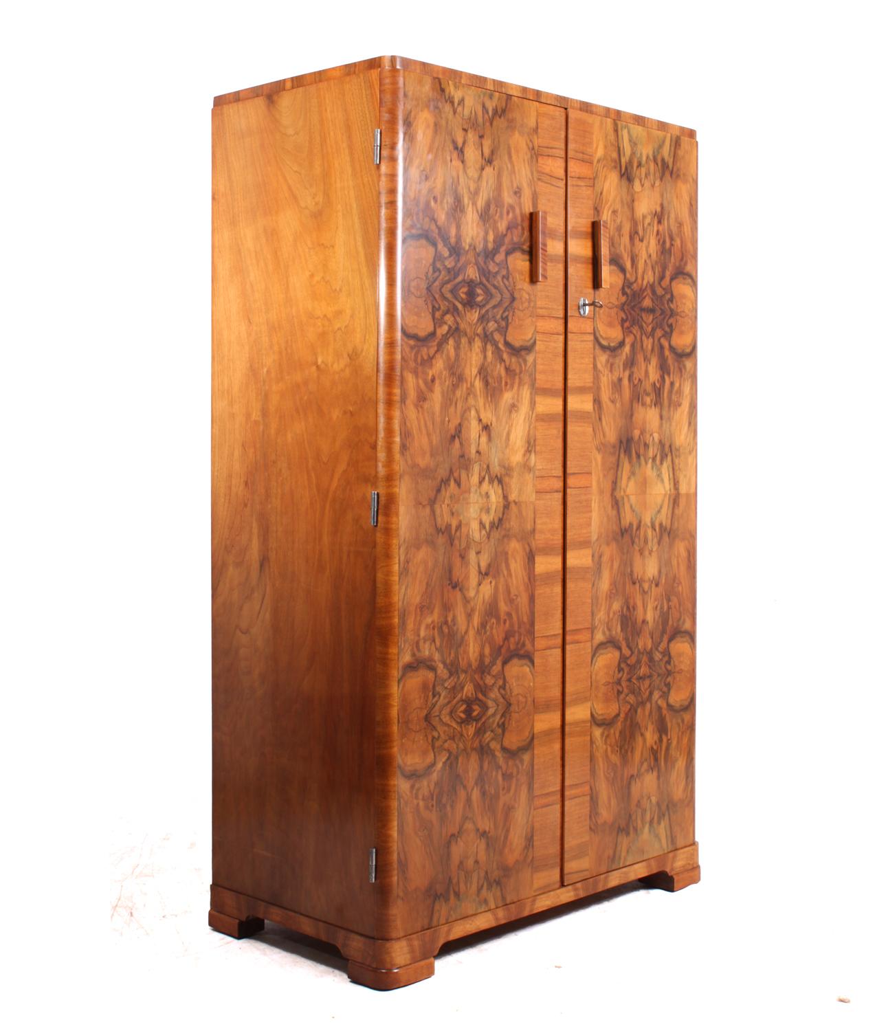 Art Deco walnut gentleman's wardrobe
A very good looking small wardrobe, partly fitted with shelves and slide out hanging rail and tie hanger, lock and original key, the wardrobe has been fully restored and polished and in excellent condition