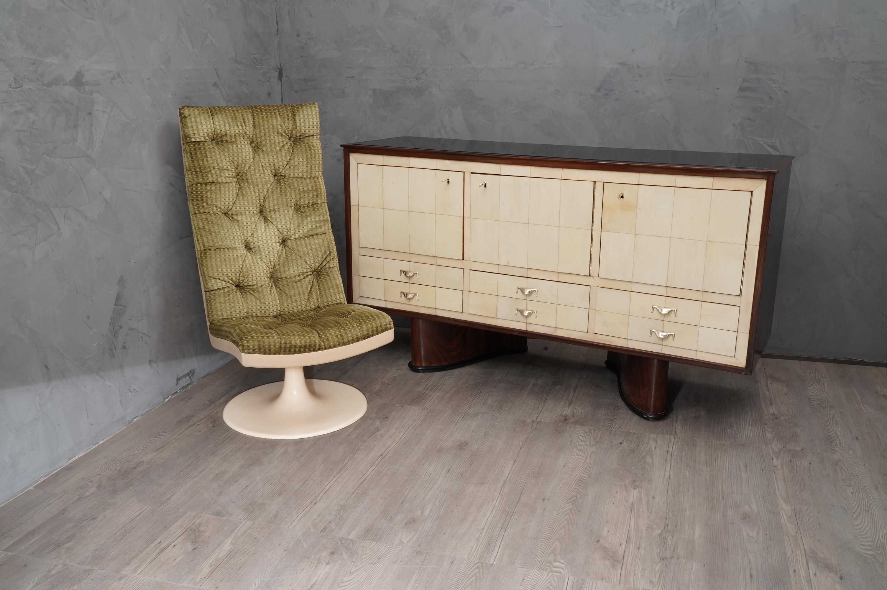 Splendid storage unit due to the use of special materials such as walnut goatskin and glass; in perfect union with brass handles and keys.

Italian sideboard all veneered of walnut wood, with front covered in goatskin. The top is instead in black