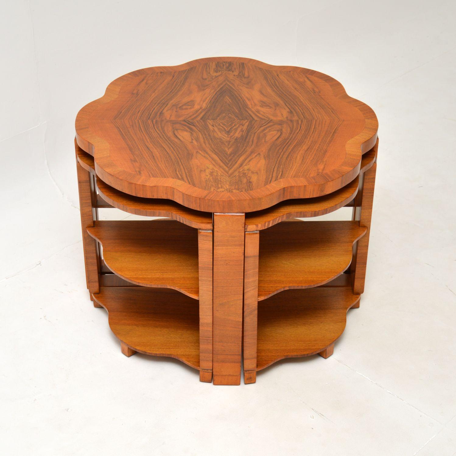 A fantastic Art Deco walnut nesting coffee table by Epstein. This was made in England by Harry & Lou Epstein, it dates from the 1930’s.

This is of superb quality, with a beautiful flower shaped top and thick edges. It has a very useful design, with