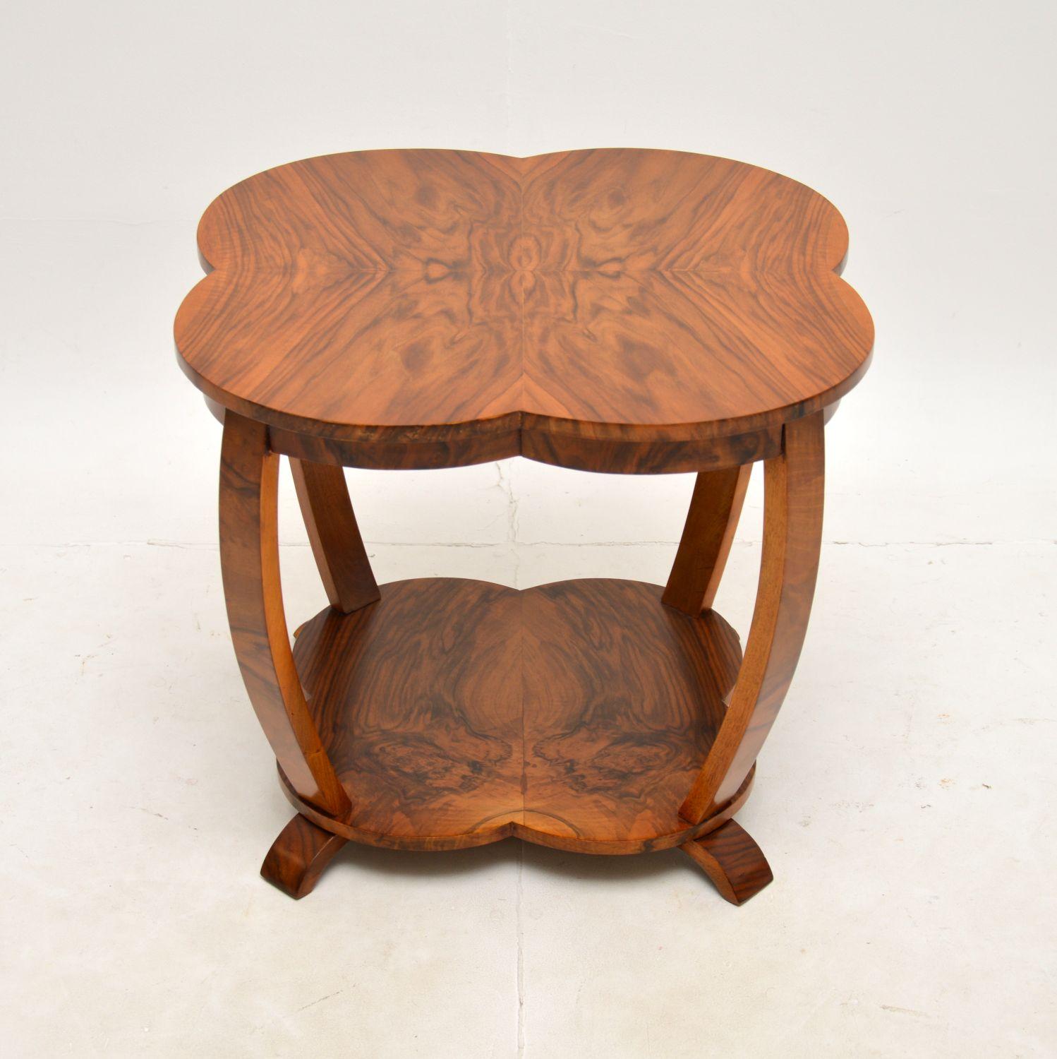 A stunning original Art Deco walnut occasional / coffee table. This was made in England, it dates from the 1930’s.

It is of superb quality and has a gorgeous design, with a four leaf clover shaped top. The figured walnut grain patterns are very