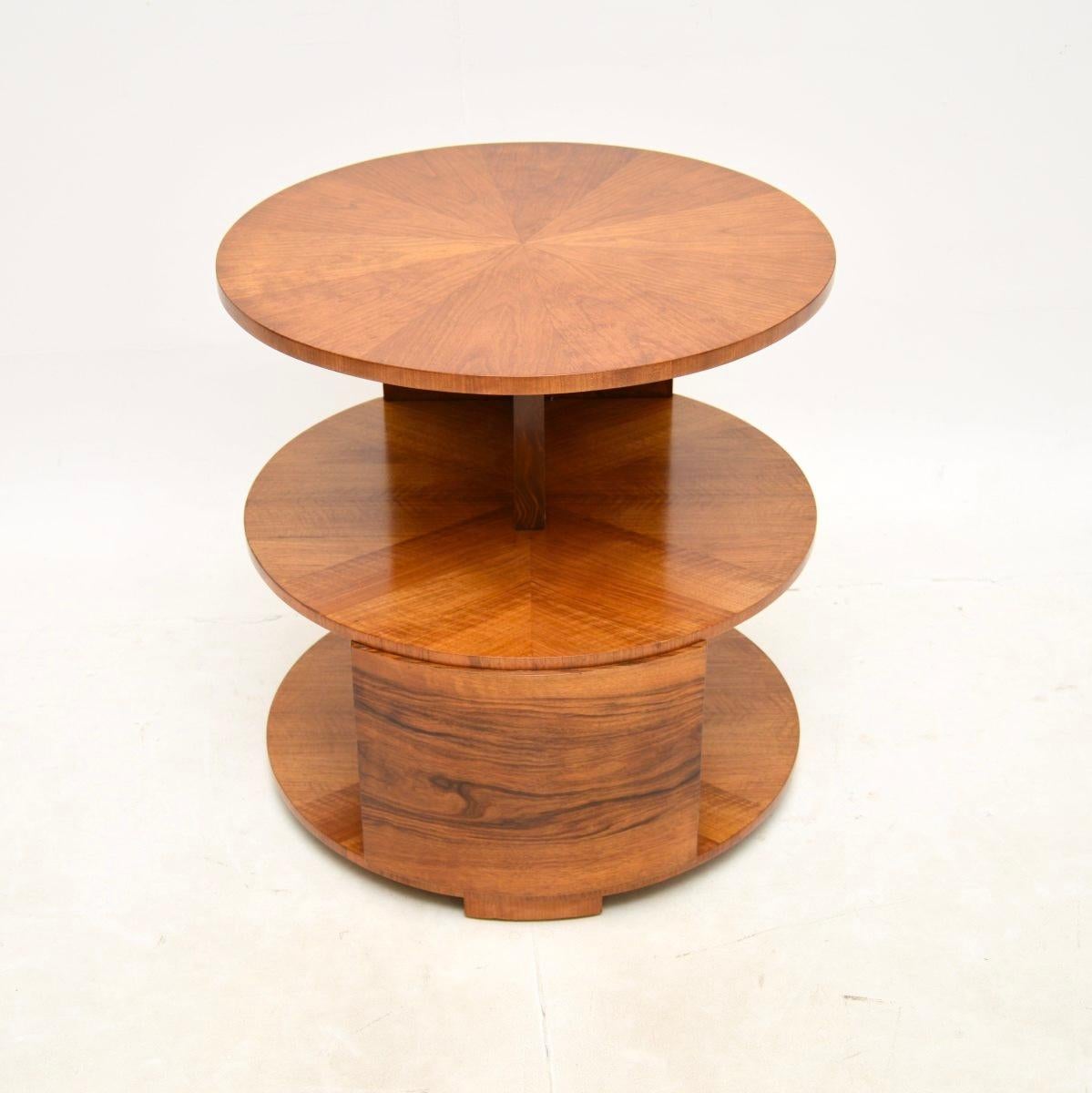 A fantastic original Art Deco walnut occasional side / centre table. This was made in England, it dates from the 1920’s.

It has a beautiful stepped design, with the three circular tiers overhanging each other giving an S shaped profile. The quality