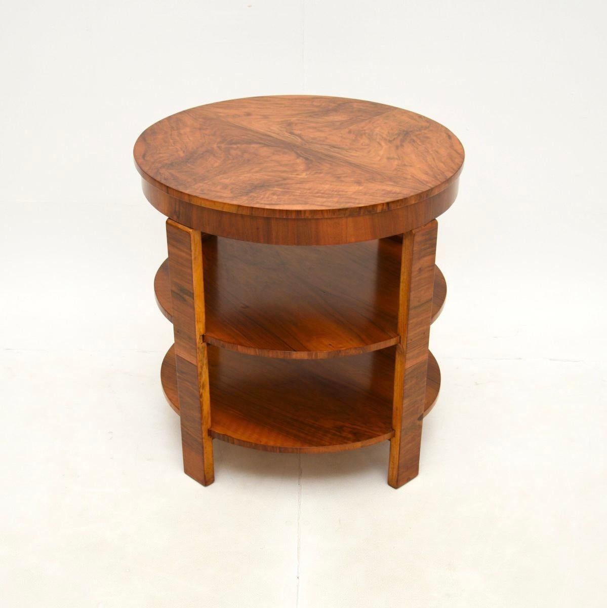 A stylish and very well made Art Deco walnut occasional side / coffee table. This was made in England, it dates from the 1930’s.

The quality is outstanding, this is beautifully crafted with a circular top, nicely moulded legs and an additional two