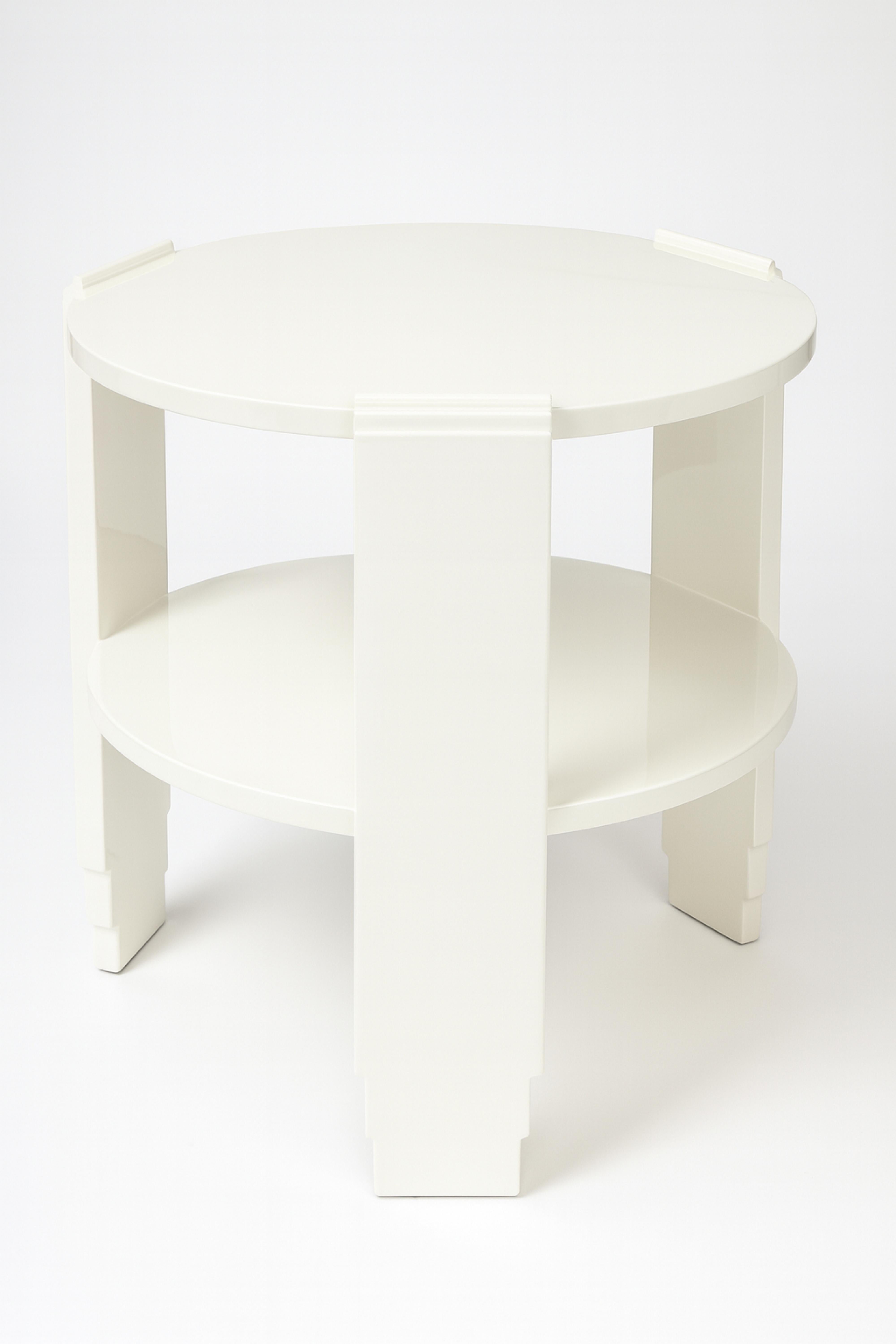 An elegant French Art Deco two-level Off-White (color reference: #F2F0EF ) Lacquer round center table. Featuring inlaid walnut detailing and a stunning central design, it is supported by three gracefully curved legs and a circular base. A timeless