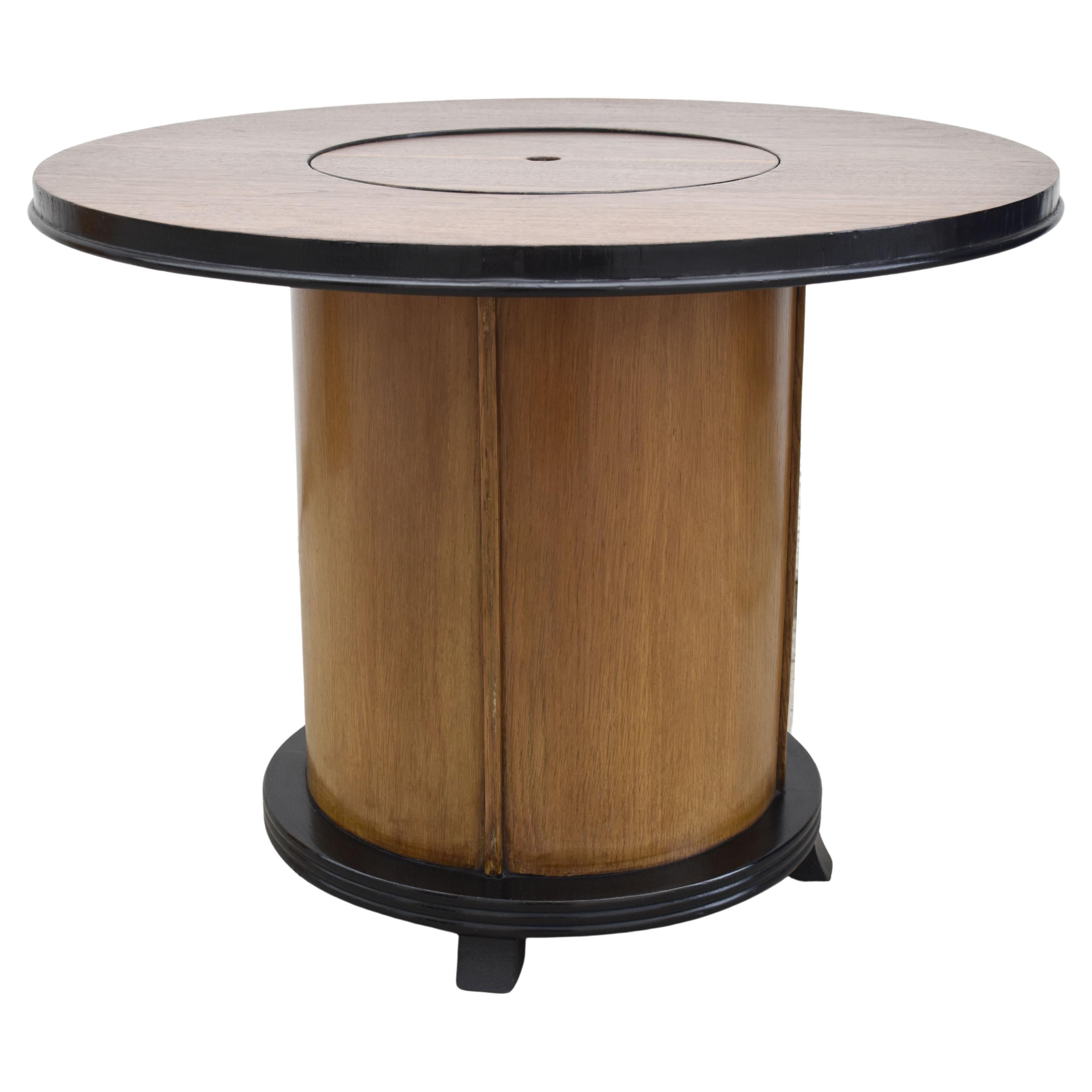 For your consideration is this rather fun and stylish original Art Deco English pop up cocktail table. When closed all you need do is press a central button which is centre to the table top and voila! up pops a second tier storage for your glasses