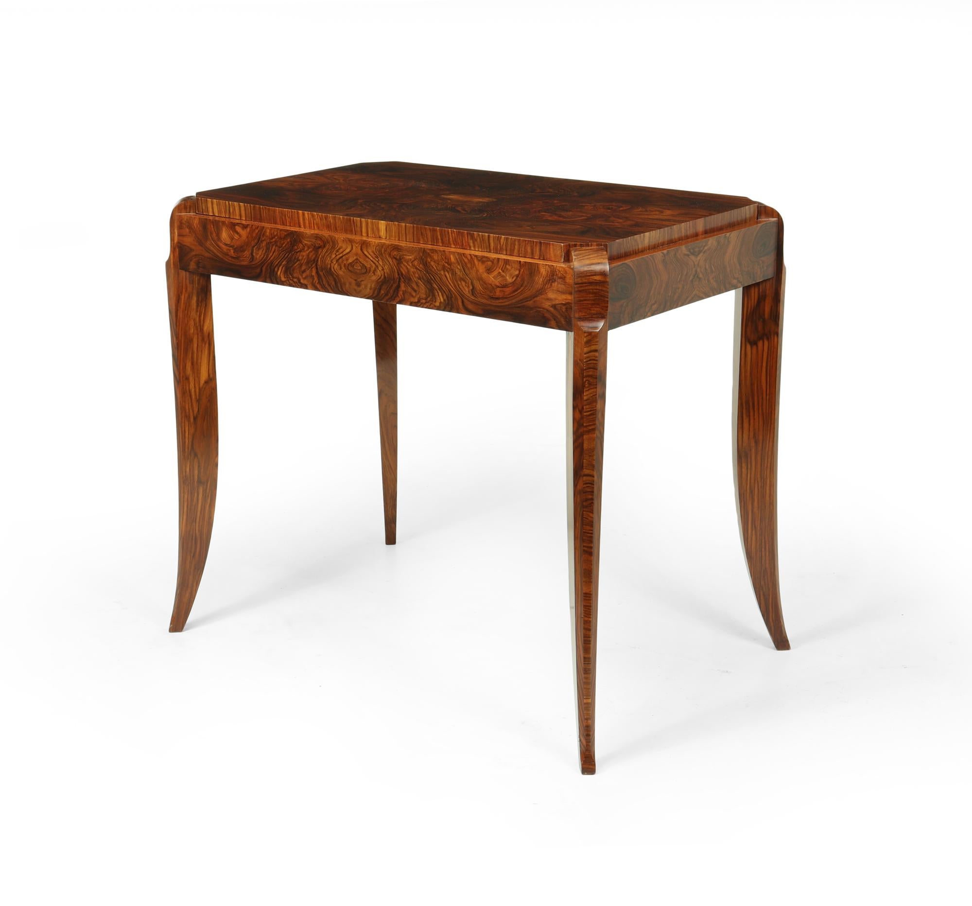 A super French Art Deco Free standing side table or center table in highly figured walnut rectangular top with canted corners standing on sabre legs. The table has been correctly restored and fully polished by hand and is in excellent condition