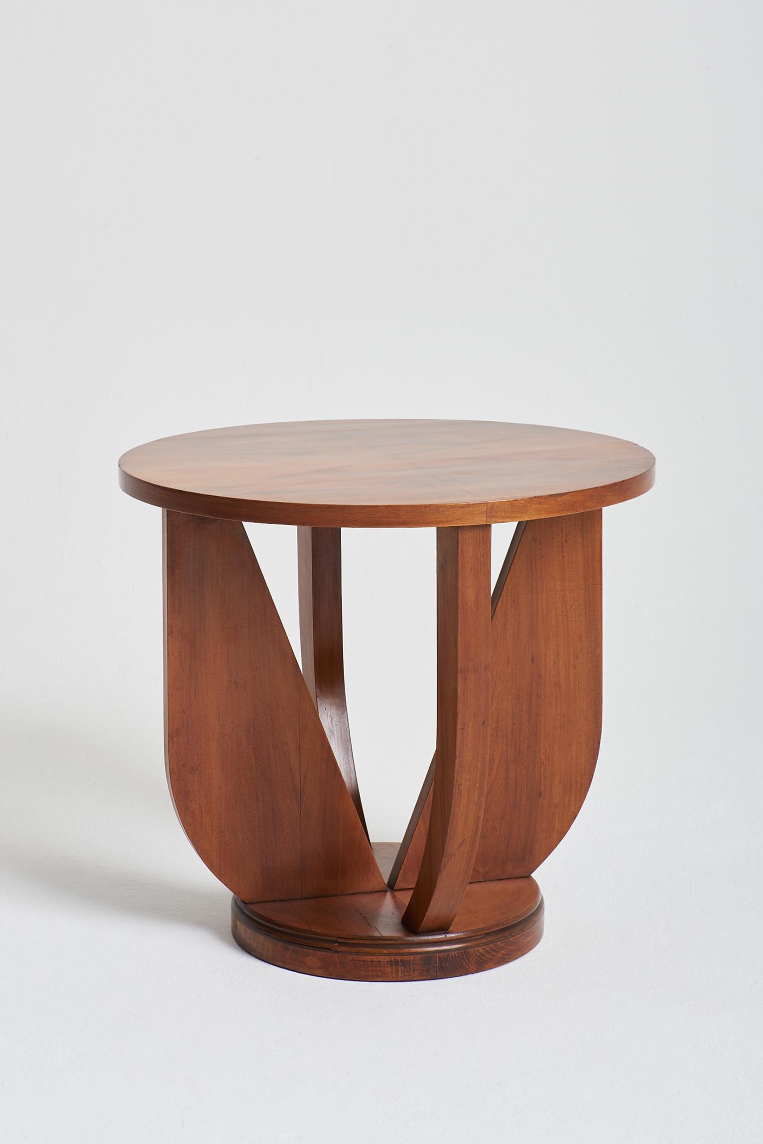 An Art Deco walnut side table.
France, Circa 1930.
