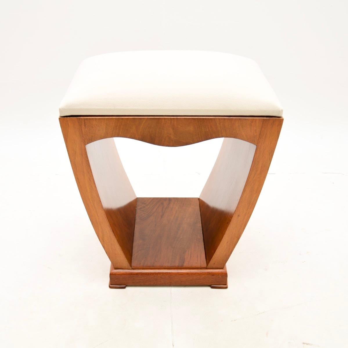 A beautifully designed and very well made Art Deco walnut stool. This was made in England, it dates from the 1920-30’s.

It is typically Art Deco in style, the walnut frame has beautiful curves and tapers nicely towards the base. The walnut grain